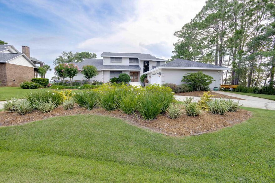 This fully renovated Bluewater Bay home rests on arguably one of the most desirable bay front lots in Okaloosa County.  The 3,263 sq. ft, 4-bedroom, 3.5 bath, 2-story home is at the end of a private cul-de-sac. Unobstructed 240-degree views of the Choctawhatchee Bay provide spectacular sunsets year-round.  The western side of the property meets a 10-acre estuary.  There is 200' of water frontage with an aluminum sea wall, added rip rap, and a new dock/piling with a 6,000 lb. boat lift. The open floor plan provides water views from every room on the first floor, to include the master bedroom, kitchen, dining area, and office.  An additional bedroom on the lower level is currently being used as an exercise room, but it could also serve as a second office.  Recently refinished antique heart pine floors cover much of the main level.  Shiplap accent walls throughout add a coastal cottage feel.  A newly added mudroom, laundry, and ?? bath lead to a private side entrance deck with an outdoor shower.  
The open staircase leads to two additional bedrooms and a full bath.  The upper level deck provides additional magnificent bay views.
No HOA.  Seller has an updated survey and elevation certificate.
