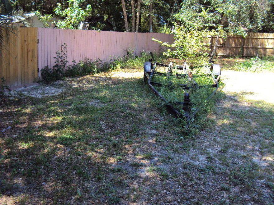 Beautiful level lot, back part of lot fenced, septic tank is in. Most of lot is cleared, nice trees in back yard.Nice front yard.