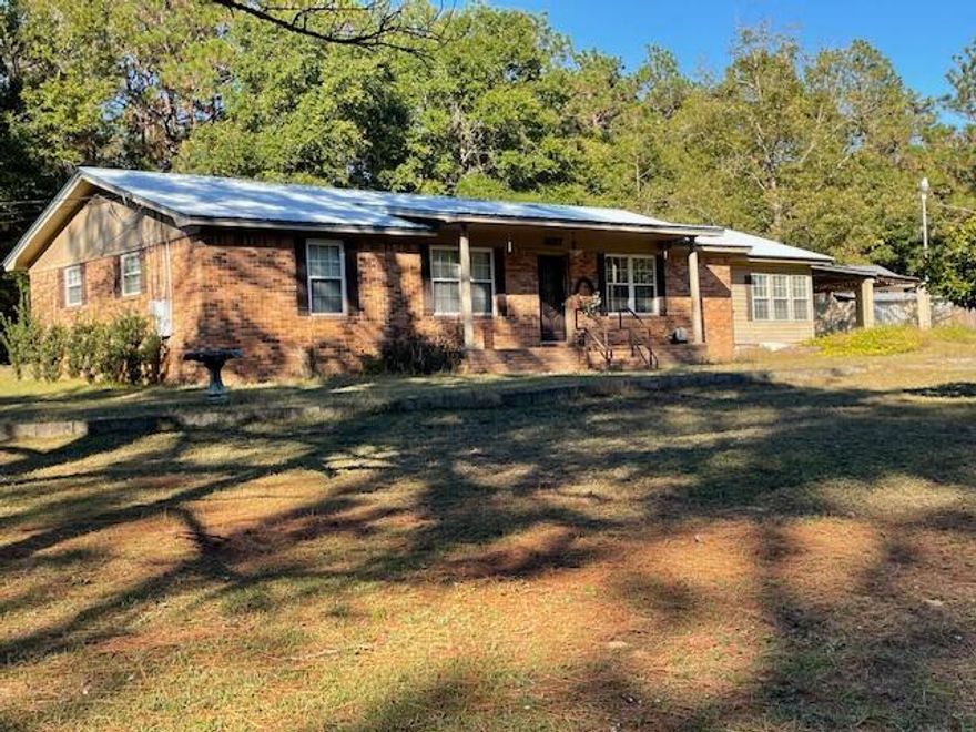 Great possibilities with this older Brick Home with ''GOOD BONES''  Layout is very good.  Owner was a cabinet builder and the kitchen is very good with lots of cabinets and storage. Best part is lot is a full acre completely fenced, and there are two outbuildings for hobbies, or storage.  Electric to both, Water/sink in one.  Open Carport to double as entertainment area, and a bonus sunroom with sink.  This is not heated or cooled but could be very easily.   Home to be sold ''as is''.  I.important components upgraded.  Metal Roof is 10-12 years old, HVAC 9 years old, Electric Hot Water Heater 2 years old.    Mayhair is a Dirt, unmaintained Street, and will NEVER be unless the owners upgrade it to meet Okaloosa County Requirements, but Old Hickory is paved and a double gate provides access.