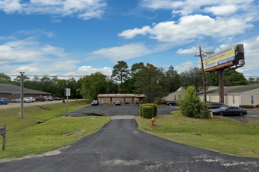Don't miss this freestanding all brick commercial building with metal roof.  Conveniently located to the hospital, airport and air force bases. The office building boasts 1800 sq ft with 5 individual offices and 2 large rooms with plenty of space for cubicles or more offices.  New flooring,  2 bathrooms and a kitchenette.  With 2 front doors this floorplan design could be divided into 2 separate main offices... use one yourselves and rent one for income.