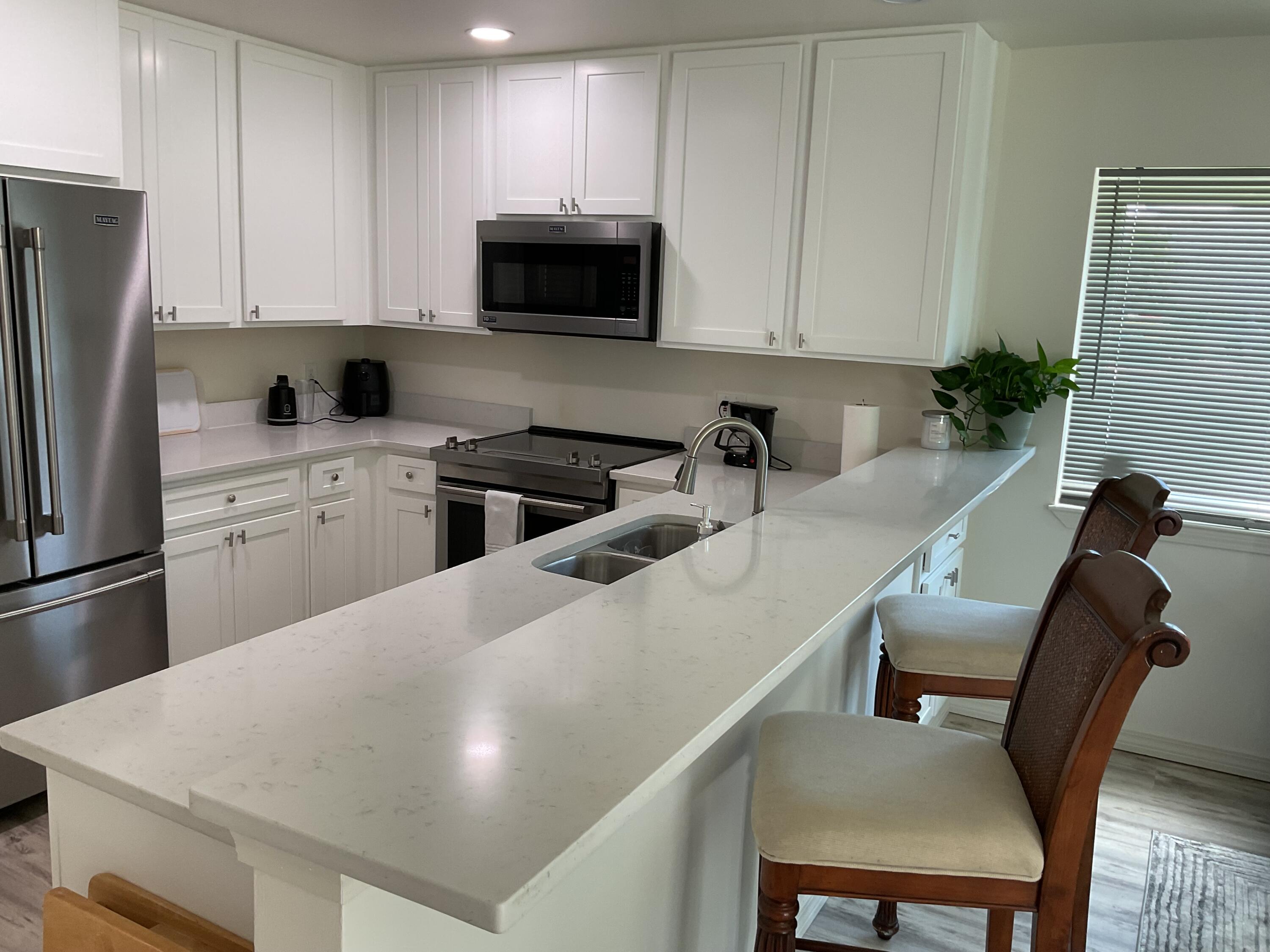 Opportunity is knocking on holiday Isle!! This is a newly remodeled ground floor, light & bright corner unit at Island Home Condos The entire unit was gutted to the studs and rebuilt all new in 2024. Everything was replaced except two windows. High-end stainless appliances, brand new HVAC.HOAallows for short term , midterm, and or longterm rentals. Enjoy easy laid- back living in this fabulous space.Private beach access steps away from the sugar beaches of Destin.