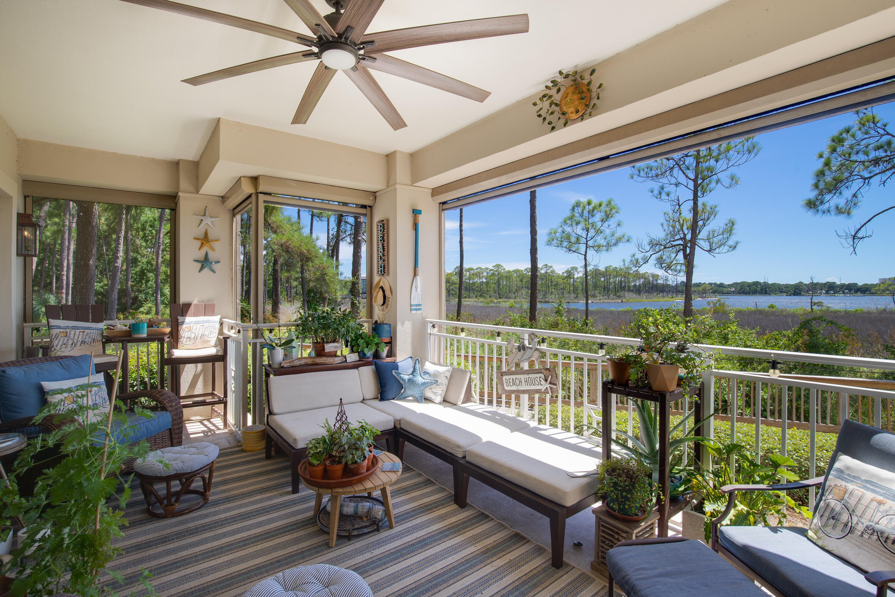 Rare Bayfront Condo with Upscale Interiors, Garage and Private Yard. Enviably located overlooking panoramic views across Choctawhatchee Bay, this exceptional four-bedroom condo at The Anchorage is a rare find. Offering all the conveniences of condo living, this well-designed property also has a sought-after garage and a private fenced yard overlooking the bay. The open living area and bedrooms deliver panoramic waterfront vistas that extend across the tranquil bay from Baytowne Marina to Mid Bay Bridge. The master suite includes a walk-in closet and spa-like ensuite bathroom with a whirlpool tub while guest bedrooms all have en suites and access to a lanai. Relax in the generous covered lanai or step through the retractable screen into a delightful fenced yard complete with view of Jolee
