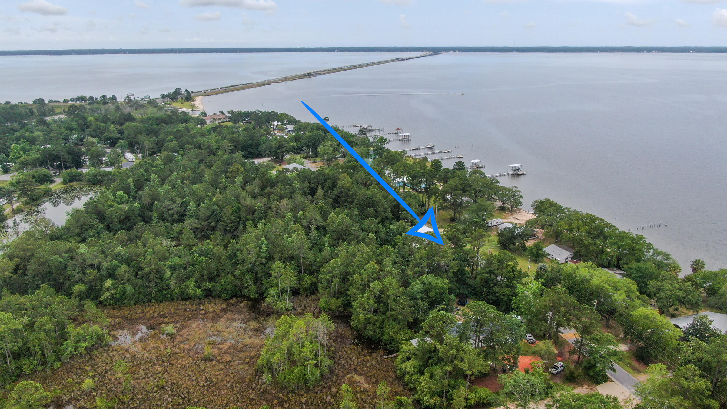 Gorgeous tree'd 60'x150' residential lot across from the Choctawhatchee Bay. Build your dream home here! The property backs up to a preserve so no backyard neighbors. Views of the Bay and sunset. Located near Grady Brown Park which features boat launch, boat and trailer parking, playground, restrooms, and covered picnic areas. 7 minute walk to Grady Brown Park. 6 minute drive to Publix Grocery Store in Freeport. 15 minute drive to Blue Mountain Beach public access.