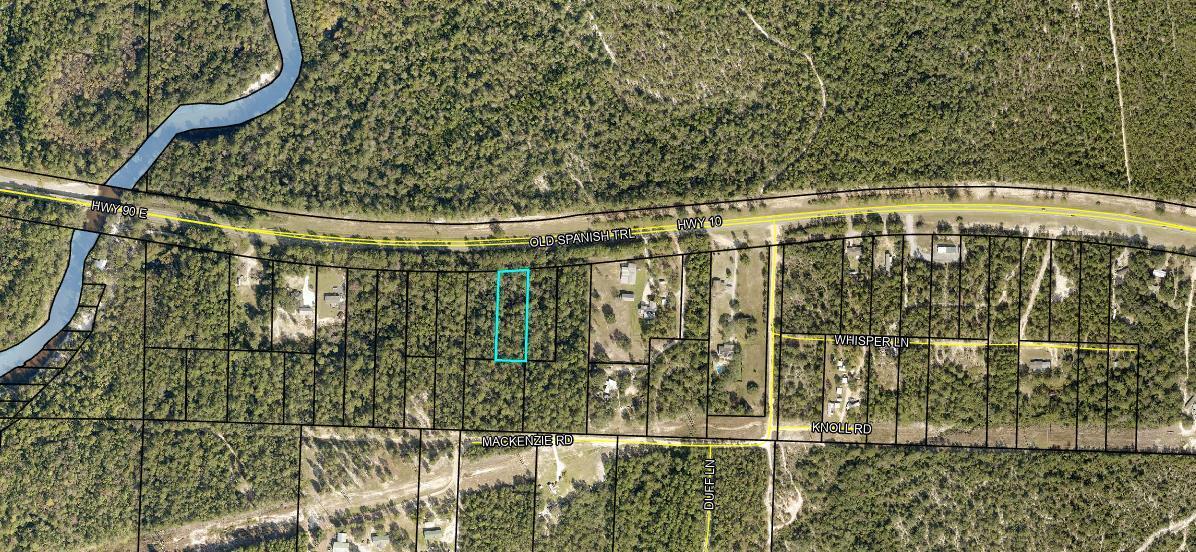 One Acre wooded lot on a slightly slopped parcel with no restrictions. Just a block from the Shoal River boat launch. No Survey available.