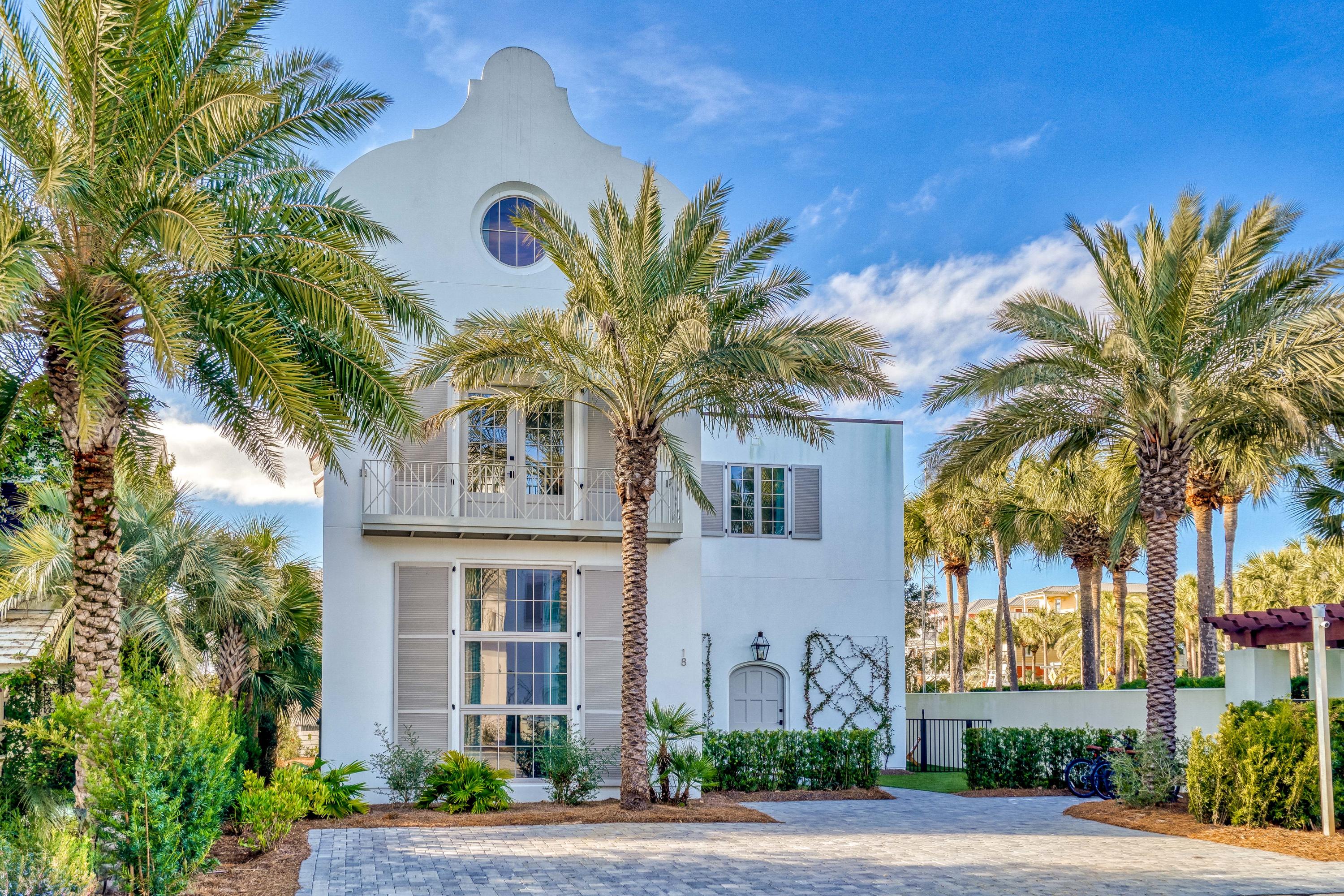 A STUNNING WHITE STUCCO 5 BR/4.5 BA HOME w/ tile roof is in the PRIVATE GATED SOUTH SIDE COMMUNITY of ELYSEE, between Alys Beach & Rosemary. ONLY 19 HOMES have the OPPORTUNITY  to live in this SANCTUARY so close to the BEACH. Home is a collaborative from Benecki Homes of Atlanta, Architect Bill Ingram & Melanie Turner Interior Designs. The 1st level is flooded w/ natural light from a multiple story wall of plate glass. Walls finished in VENETIAN PLASTER & wood blend w/ wire brushed oak floors throughout & reclaimed beam ceilings. HUGE LIVING AREA opens to the DINING area & floating staircase. FANTASTIC MASTER suite is centered between 2 GUEST SUITES on 2nd floor. 3rd floor has 2 more GUEST suites. PRIVATE POOL w/ turf courtyard makes this a PERFECT FAMILY HOME or GREAT RENTAL INVESTMENT!