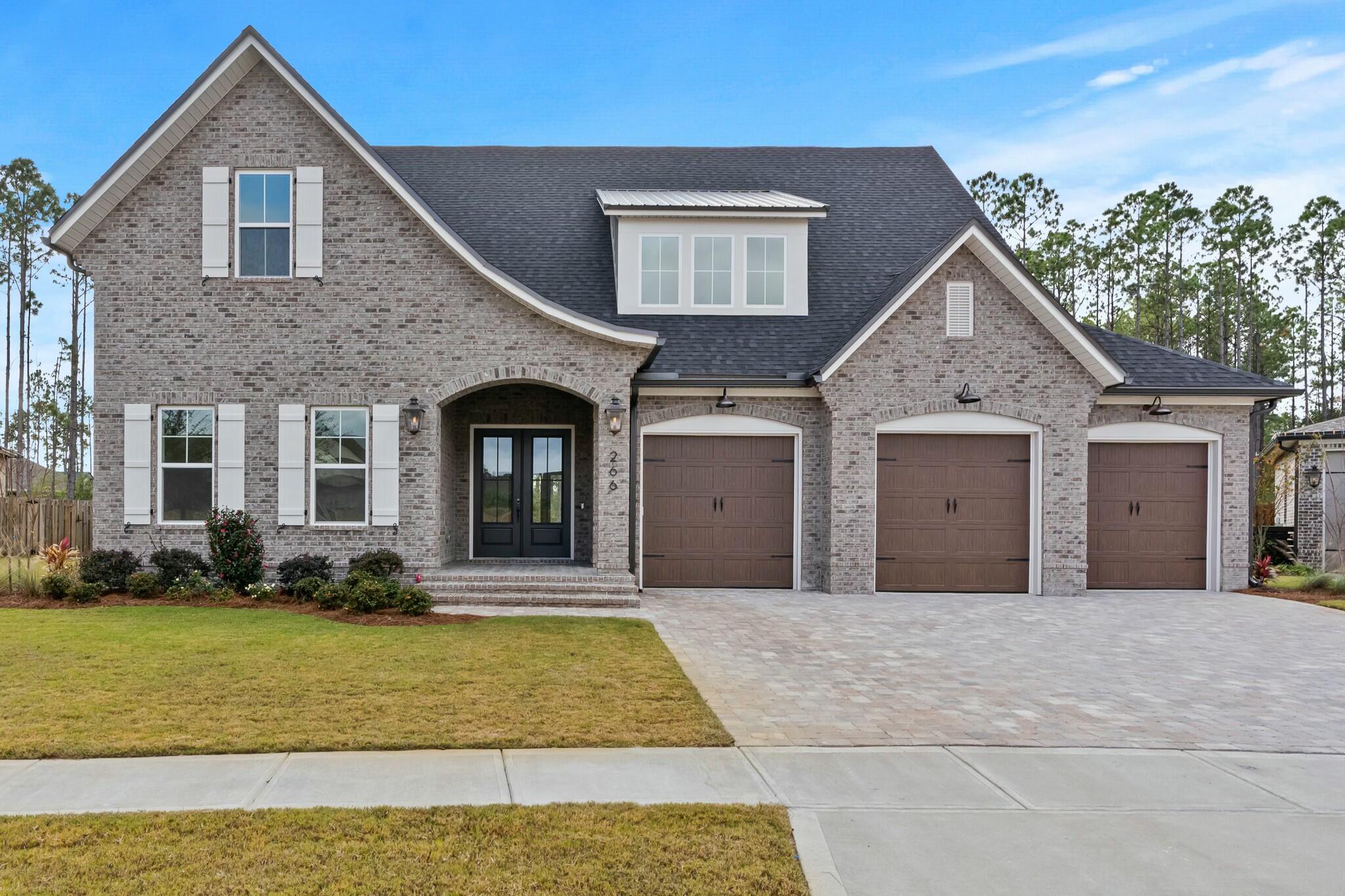 One of the last remaining preserve homesites in the prestigious gated neighborhood, Vineyards at Hammock Bay. This home features a wonderful yard backing to natural preserve. Your buyer can enjoy the views from the oversized rear covered porch featuring a full summer kitchen. Great room with brick fireplace with views to the backyard has full back wall of windows onto rear porch. Kitchen includes furniture grade cabinets to ceiling, Cambria quartz countertops, full size built in fridge and freezer, gas cooktop. Wood floors throughout. Separate his and her vanities and closets in master suite. Huge game room and walk in storage upstairs with 2 bedrooms. 10' ceilings throughout. Solid core interior doors. Full 3 car garage.