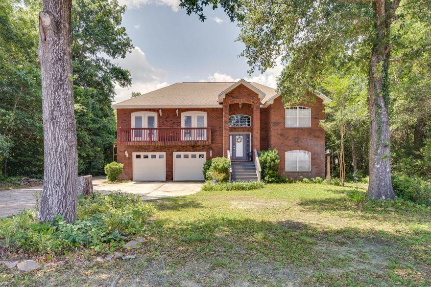 Spectacular view of Choctawhatchee Bay on nearly three quarters of an acre. Beautiful two story, 3 bedroom, 3 bath, brick home with 75 feet of Bay frontage and a 160 foot dock for fishing, dolphin watching, or relaxing while enjoying our wonderful Florida sunsets. This double lot extends from Hwy 20 to Live Oak Rd. Plenty of room for a pool and the additional lot behind to build a spec home or income producing rental home. Split bedrooms upstairs with a full sized recreation room and full bath downstairs. Master bedroom and dining room have private balconies overlooking the bay. Brand new kitchen appliances and wood-burning fireplace in the living room. Back elevation has elevated deck on second level. A must-see at a great price!