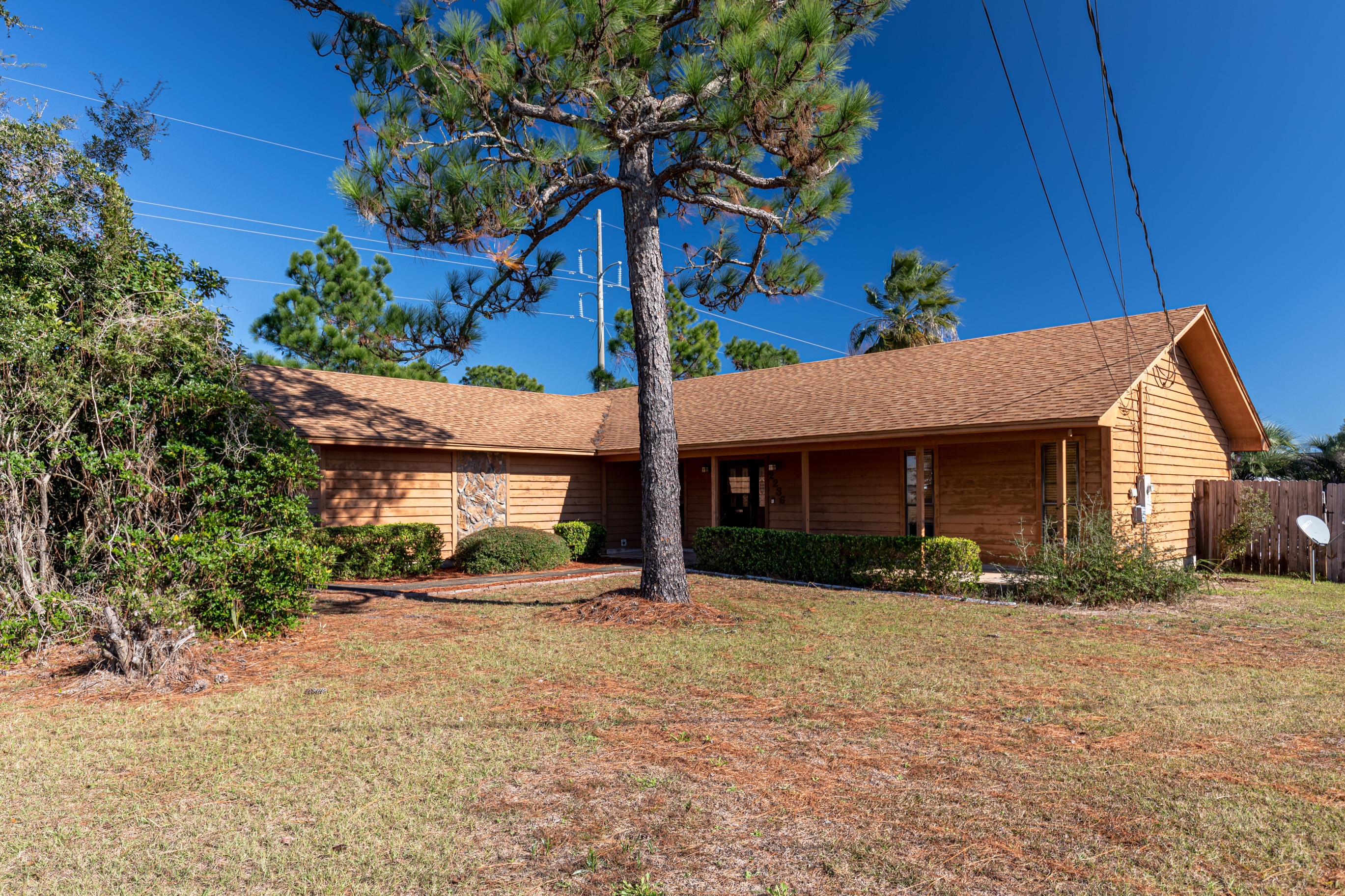 There are far too few affordable properties along the Emerald Coast with actual ''personality.'' Welcome to 2236 Fox Den Drive, a home that is absolutely bursting with it! Located on a quarter-acre lot in a charmingly spacious neighborhood, and conveniently situated between Hurlburt Field and the city of Navarre, this cedar-sided home is the perfect investment for a growing family. Like swimming? How about taking a dip in this lavish pool surrounded by privacy fencing and lush palms, plus a green area for the pets! If that's not enough, this home features a capacious master bedroom, with an en suite sporting a jetted garden tub and separate shower. The living and dining area are pleasingly open-concept as well, allowing tons of light while sporting great views of the pool. This is the one!