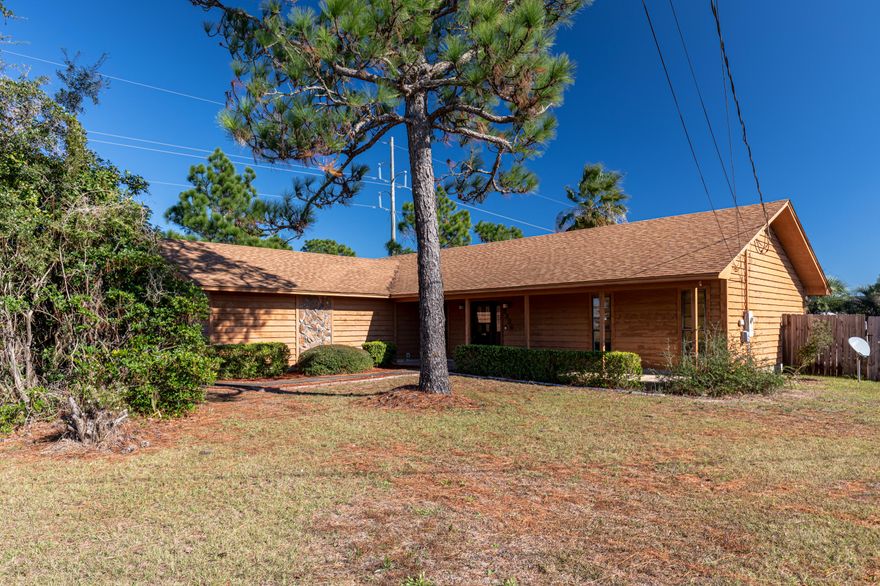 There are far too few affordable properties along the Emerald Coast with actual ''personality.'' Welcome to 2236 Fox Den Drive, a home that is absolutely bursting with it! Located on a quarter-acre lot in a charmingly spacious neighborhood, and conveniently situated between Hurlburt Field and the city of Navarre, this cedar-sided home is the perfect investment for a growing family. Like swimming? How about taking a dip in this lavish pool surrounded by privacy fencing and lush palms, plus a green area for the pets! If that's not enough, this home features a capacious master bedroom, with an en suite sporting a jetted garden tub and separate shower. The living and dining area are pleasingly open-concept as well, allowing tons of light while sporting great views of the pool. This is the one!
