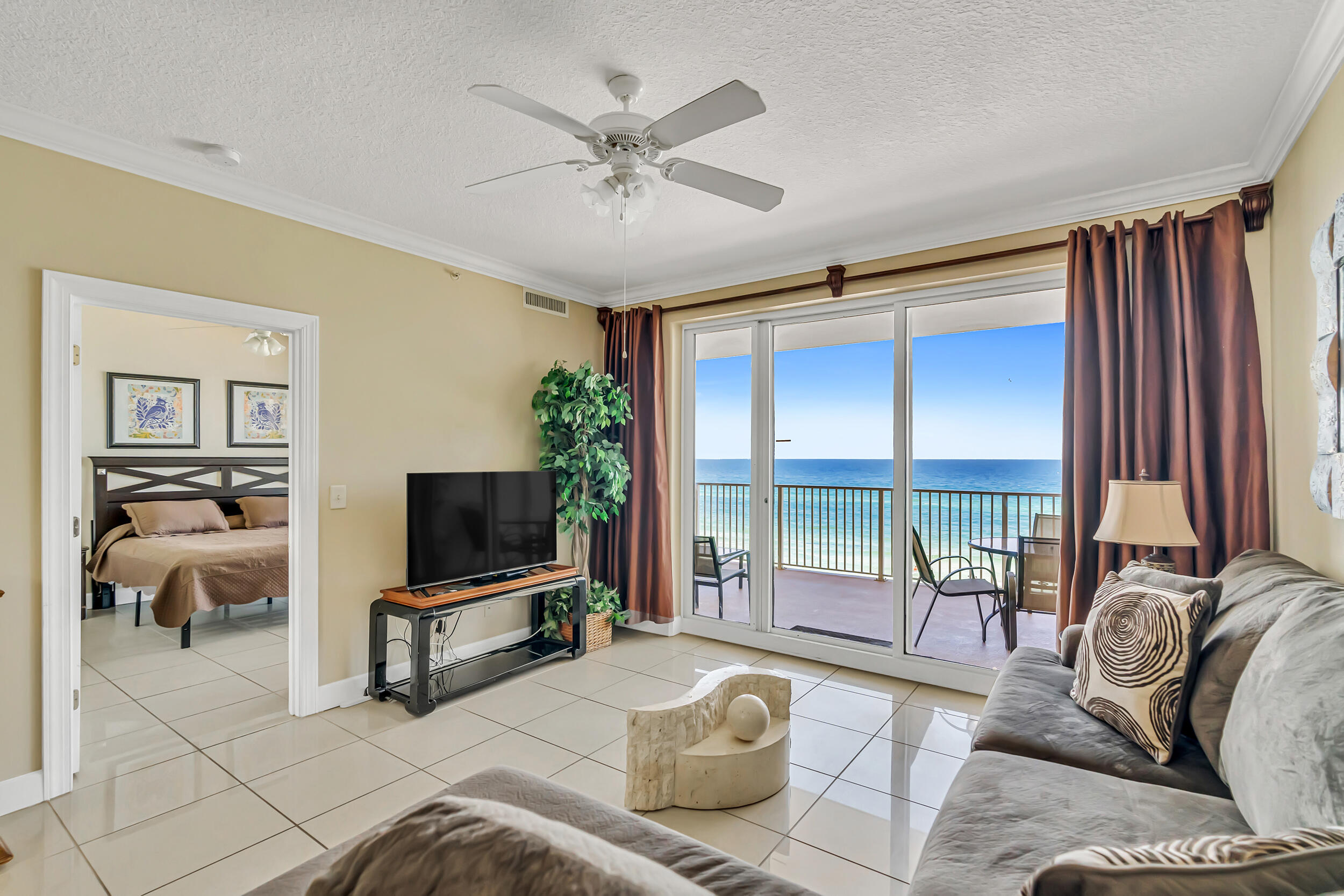 This 2 BR 2 BA is located at Ocean Reef, a Gulf-front condo in beautiful Panama City Beach! The unit is sold fully furnished and includes TWO deeded parking spaces in the garage--A RARE AND VALUABLE PERK! The condo features a desirable open floor plan, with no carpet for easy beachside living and maintenance. Step out onto the oversized balcony overlooking the Gulf, accessible from both the living area and primary suite, perfect for relaxing mornings or sunset evenings. A large laundry room provides added convenience and extra storage. Ocean Reef amenities include gulf front pool, indoor heated pool, hot tub, fitness center, sauna, BBQ and picnic area and direct beach access. Are you seeking a vacation getaway, full-time residence, or investment property? This turn-key condo is for you!