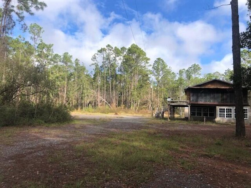 Home has Road Frontage of 277ft on Dog Track Rd this 3.7 Acre is a combination of 3 LOTS on a corner lot.  A Secluded Property by Blue Angel Pkwy only 10 minutes from NAS. CORRY STATION. Convenient to Navy Hospital, Shopping and the Beaches. The home needs work and some consideration of value was given for home but overall value is in the 3 lot parcel. Appraisal completed and came in above list price. BUYER TO VERIFY ALL PERTINENT INFORMATION.