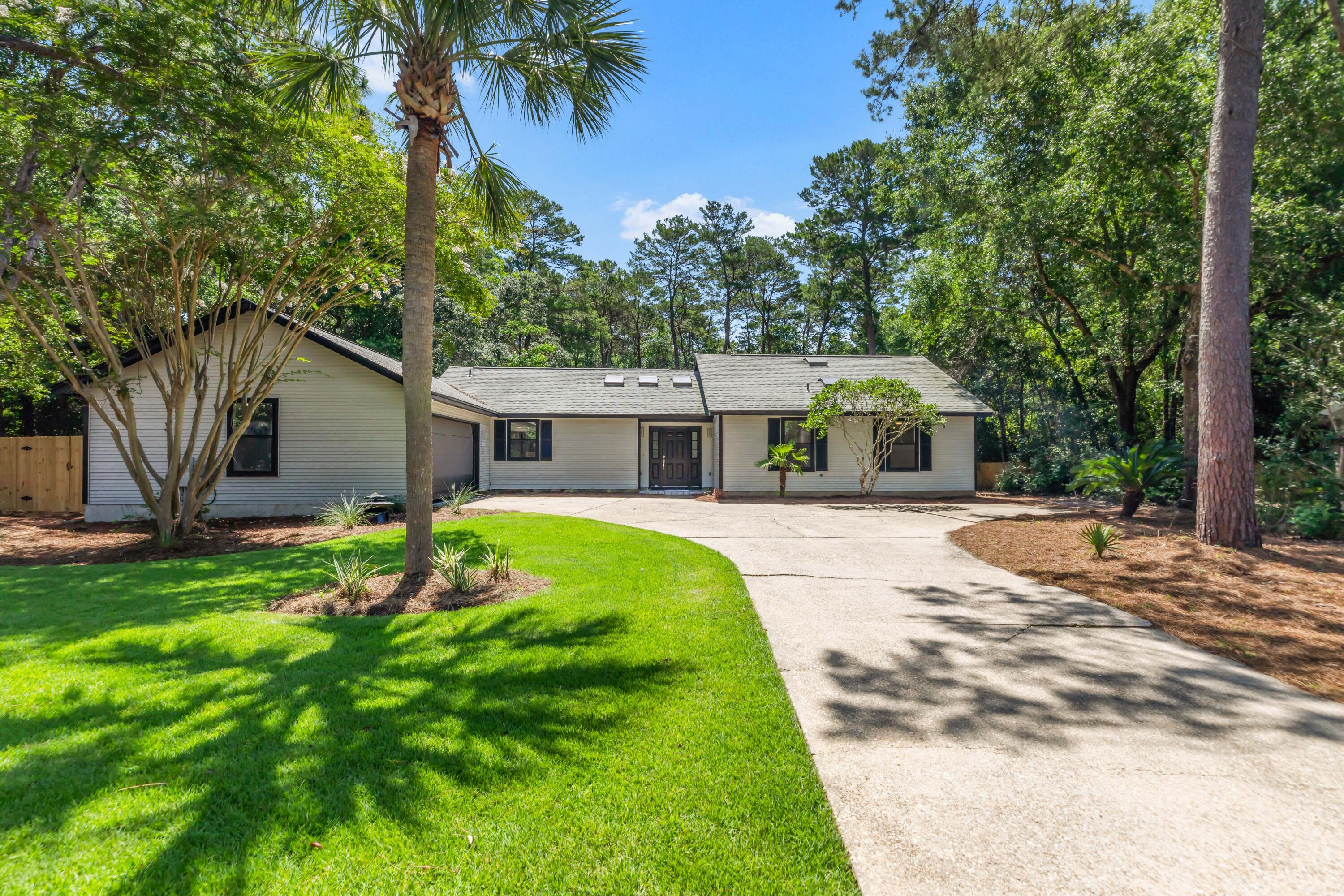 Beautifully Remodeled Home in Highly Sought-After Bluewater Bay! This stunning 3-bedroom, 2-bath gem nestled on a spacious .51-acre lot backing up to the scenic Bluewater Bay Walking Trail. This home offers both privacy and convenience in a tranquil setting. Bright and welcoming formal living area, perfect for relaxing or entertaining. Chef style kitchen with modern finishes, a generous breakfast bar, and opens seamlessly to the formal dining room, ideal for hosting family dinners or social gatherings. The master suite is complemented with a walk-in closet, dual sinks, and a walk-in shower. Two additional bedrooms offer comfort and ample storage, perfect for families or guests. Large fenced backyard, shaded by mature trees. Located just minutes from shopping, dining, schools and beaches. Plenty of room for a pool!! Don't miss your chance to own a move-in-ready home in one of the area's most beloved communities!