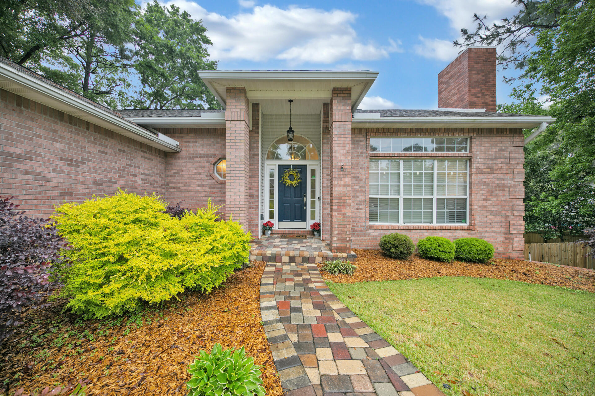 Exceptional 4 bedroom home with 2 living areas, a large fenced-in, private backyard with running stream, bridge and firepit. Upgraded landscaping, paver driveway, gutters and easy to maintain brick and vinyl siding. Upon entering the home you are welcomed by the warm bamboo flooring which flows from the foyer all the way through the main living areas and master bedroom. The open living and dining room is graced by vaulted ceilings and neutral paint throughout. Around the corner is the light and bright updated kitchen with ample counter space, upgraded appliances plenty of storage for all your cooking and entertaining needs. Just steps away from the eat-in kitchen you will find a wonderful deck overlooking the gorgeous, private backyard.