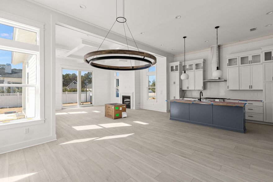 The Windsor Plan by Boswell Builders offers nearly 3,000 square feet of refined living space and thoughtfully curated upgrades throughout--including a private pool and outdoor kitchen for year-round enjoyment. Step through the welcoming front porch, highlighted by a gas lantern, into an expansive open-concept main level featuring 12' ceilings, wood beam accents, and a direct vent gas fireplace in the family room. With raised ceilings, 1'x6' transom windows above doors and windows invite abundant natural light into the space.The gourmet kitchen is a true showstopper, featuring an upgraded Thermador appliance package, white Carrara quartz countertops, a full-height matching slab backsplash, and a large walk-in pantry. The family room flows seamlessly to the back porch, where you'll find a fully equipped outdoor kitchen, surround sound speakers, and a tranquil private pool, ideal for entertaining. The Windsor floor plan includes 4 bedrooms, 4.5 bathrooms, and a spacious mudroom, along with a 2-car garage and 342 sq ft of combined porch space. The primary suite boasts generous proportions, a spa-like en-suite, and custom touches that elevate everyday living. Additional features include surround sound in the living room and porch, LVP flooring throughout, solid core doors, and a timeless coastal aesthetic that defines the Watersound Origins lifestyle.

The Watersound Origins community is one of South Walton's most coveted neighborhoods for its exceptional amenities, beautiful new homes, and prime location. Amenities include the Village Commons pool & fitness center, sports courts including tennis and pickle ball, miles of nature trails, dock access to Lake Powell, unlimited golf, and lots of green space for outdoor play. 

The all new Watersound Town Center brings a new level of excitement and convenience to the community with a Publix Super Market, delicious restaurants, healthcare facilities, and more right at the entrance to the neighborhood!

*Pricing for inventory homes include lot premiums and may include optional upgrades. Added options/upgrades and pricing are subject to change.