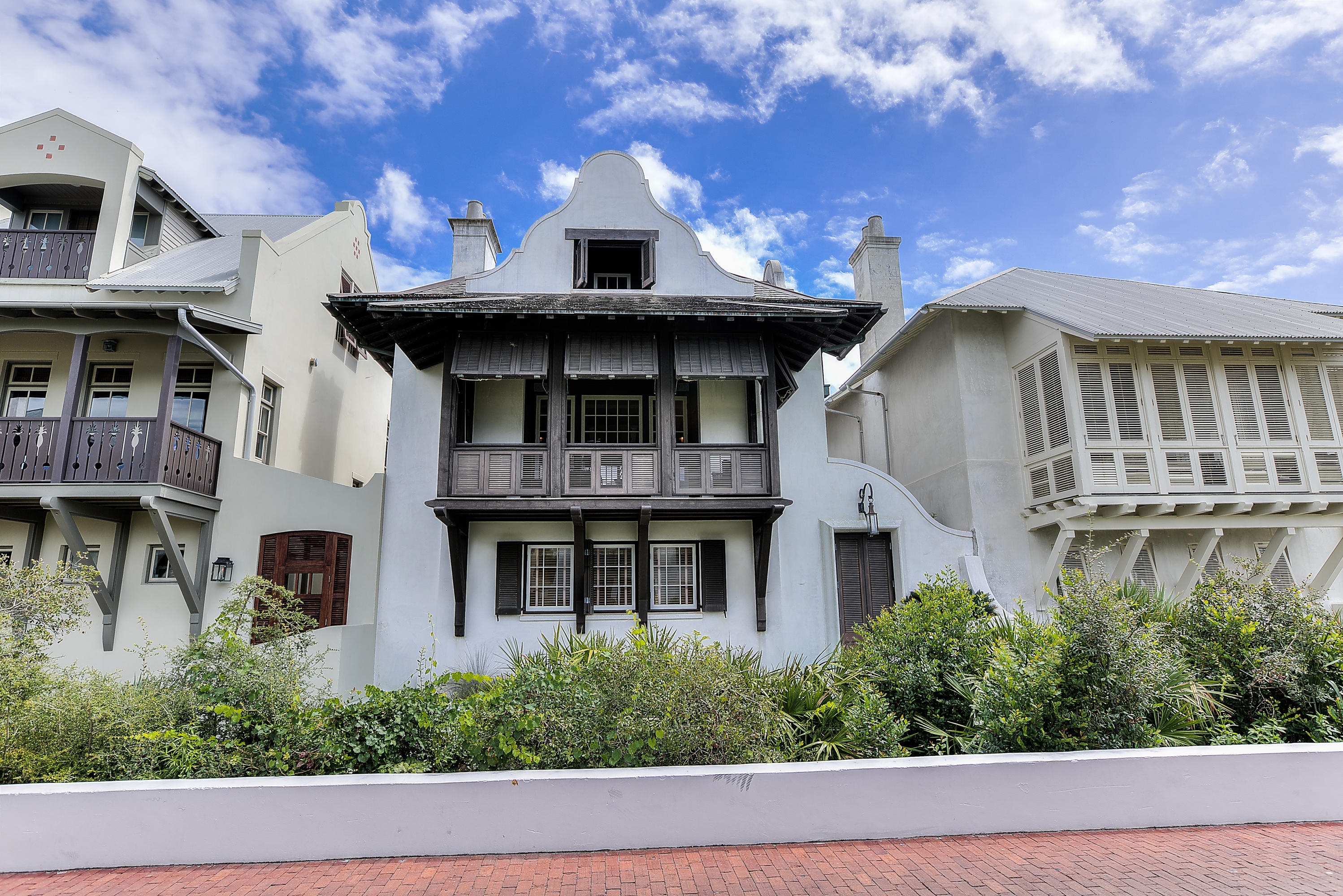 ELEGANCE, REFINED GRACE, TASTEFUL RICHNESS; excellent words to describe this classic 5BR/5BA ROSEMARY BEACH home located a stone's throw from the GULF. Situated with the beautifully manicured Eastern Green as your front lawn, this stately three story masonry home with heavily beamed rafters, cedar shake roof, copper gutters, shuttered windows, doors and porch, is a testament to EXCEPTIONAL QUALITY. Enter a calming, oasis-style COURTYARD encircled by the home. Guests of the home ascend the staircase to enter and find themselves in a sumptuous living room, tastefully decorated with exceptional furnishings and fabrics. (This exceptional quality extends throughout the house in the furniture, linens, rugs, window treatments, venetian plaster walls, etc.) Entertain your guests inside by