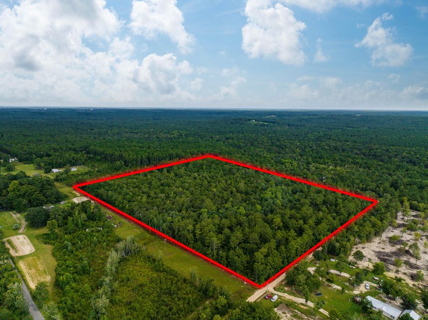 Exceptional offering of a large tract of prime land totaling 21 acres and centrally located just 30 minutes from Santa Rosa Beach and 30A, and only 45 minutes to the Northwest Florida Beaches International Airport and Pier Park in Panama City Beach. This parcel is currently wooded and comprised mostly of mature hardwood trees which would provide a beautiful backdrop for a secluded family estate or small farm. The future owner could also elect to sell the timber off the property if desired to bring in additional income. There is also the potential for this site to be subdivided into 2 parcels pending county approval. Call today for additional info.