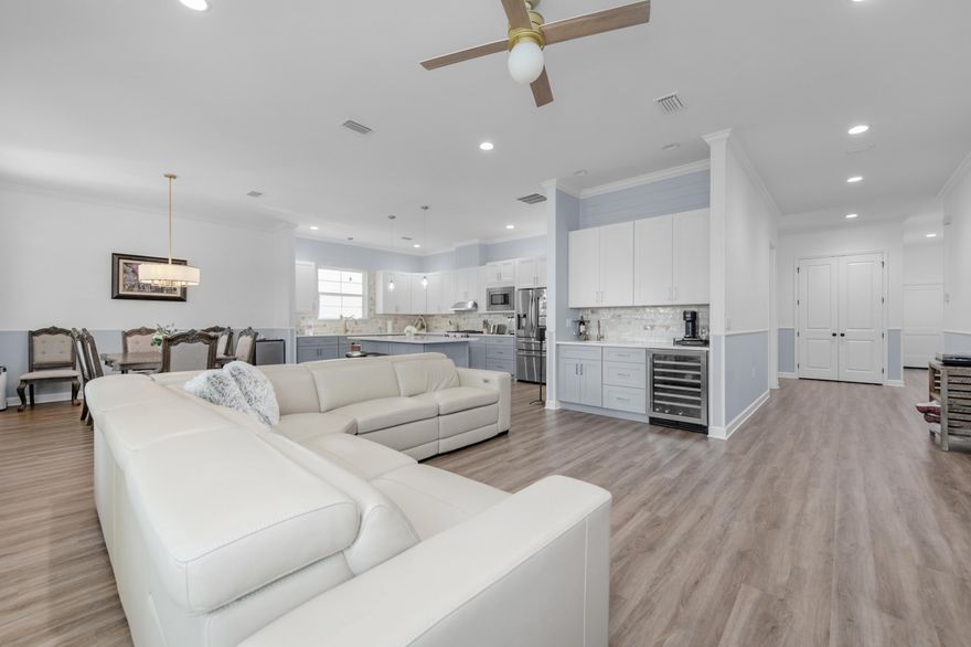 Offering an assumable VA loan at a 4.75% interest rate; this home offers plenty of space, with each bedroom having its own private bathroom and generous size. There's also a convenient half bath for guests.The open kitchen flows into the dining and living areas, featuring a large walk-in pantry, gas range, and a separate bar area with a built-in wine cooler. Quartz countertops, semi-custom cabinets, and a custom backsplash give the space a warm, inviting feel.The primary bedroom is spacious, including a large walk-in closet, extra storage, and an ensuite bathroom with a rain shower and double vanities. The home also includes a dedicated laundry room with a folding area for added convenience.