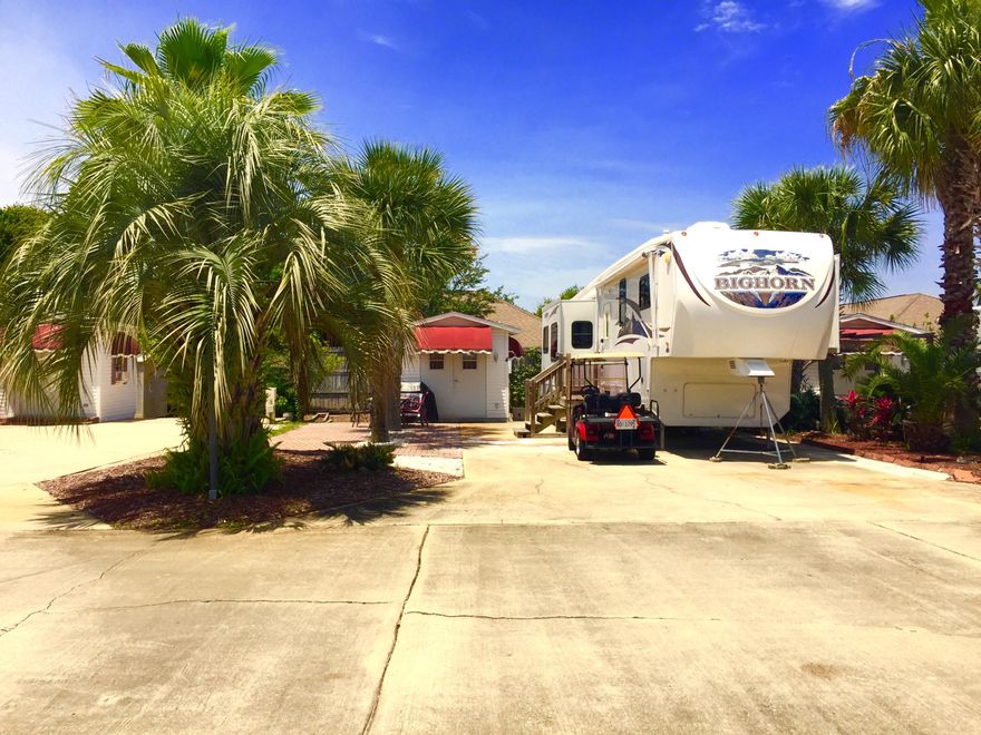 Affordable Beach Living!This beautiful RV lot is in the upscale Resort Rv Park . This gorgeous gated community features a private pool, club house and is just a short stroll from the Beautiful Emerald Coast . The Lot includes two cooled storage buildings. One is furnished with a bed, tv, refrigerator, and includes a washer and dryer.The community offers public water, Cable TV and WIFI all included with your HOA!This is a great investment opportunity to own a piece of paradise!
