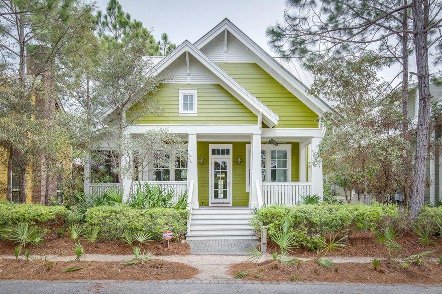 Located in a peaceful cul-de-sac, this charming Florida cottage exemplifies coastal living at its best. Overlooking a leafy park, it has a few surprises beyond the traditional front porch with its enticing cushioned swing seat. Exquisitely decorated and beautifully presented, this 'cozy cottage' has four generous bedrooms, four full baths and additional den/bunk space. Step inside through the glazed front door to find an open living room lined with shiplap. Dappled sunlight spills in through tall triple-aspect windows, lighting up the rich hardwood flooring. A dedicated formal dining area adjoins the spacious sitting area and breakfast nook. The updated gourmet kitchen will thrill the heart of keen cooks with a full range of white Shaker-style cabinets and stainless appliances.