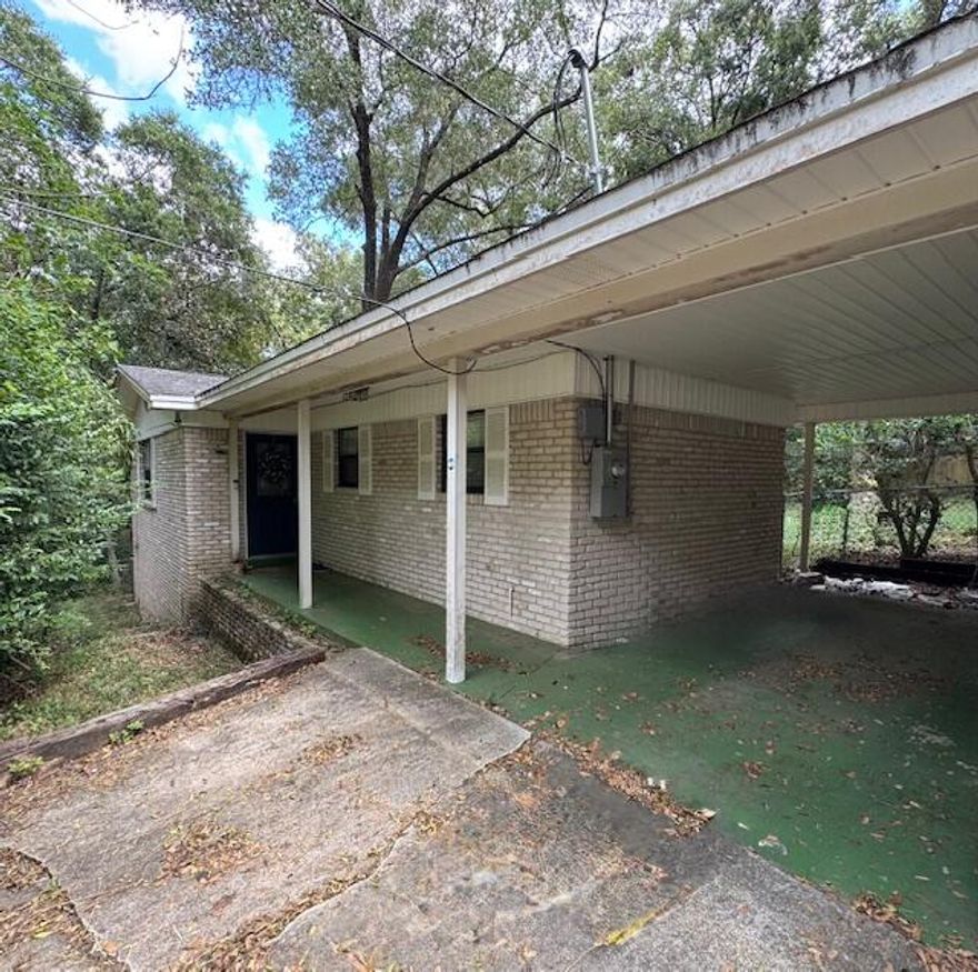 This cozy property in the heart of Niceville is perfect for your first home, next investment property, or empty nest spot! The spacious, open concept kitchen features granite countertops, stainless steel appliances & large breakfast bar.  Both bedrooms are oversized with beautiful wood flooring and the bathrooms have been updated and feature tons of natural light.  The living room boasts a wood-burning fireplace and direct access to a covered, screened-in porch--perfect for enjoying a morning cup of coffee or evening cocktail!  The roof needs replaced and the carport needs to be removed or shortened away from property line so home will not qualify for financing. Cash only.  For photos of interior from previous listing, please visit:https://bit.ly/411Redwood