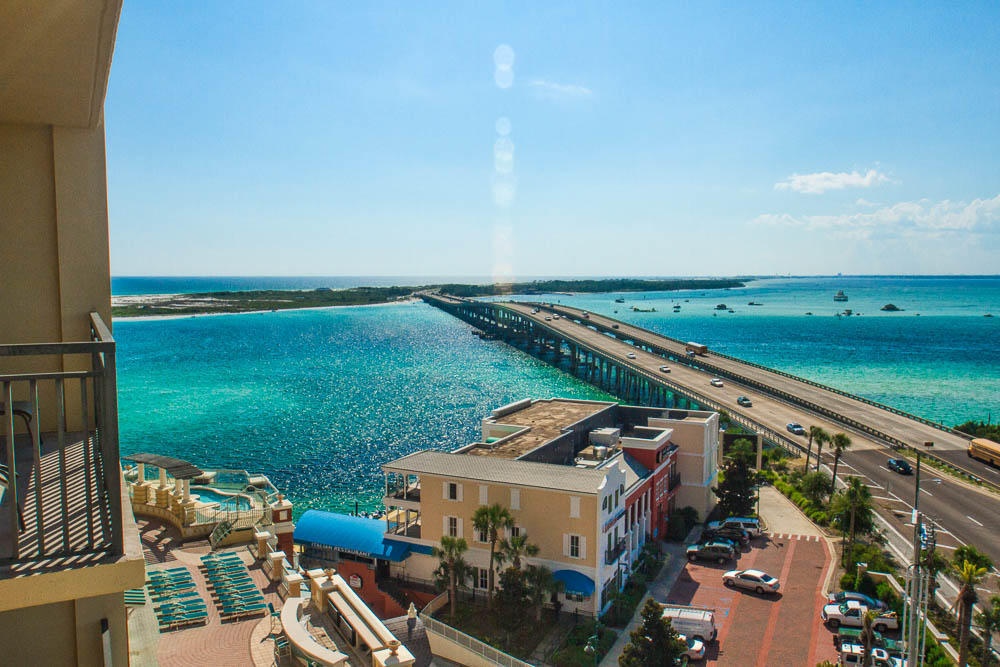Beautiful 3 Bedroom 3 Full Bath located on the 6th Floor of the Emerald Grande! An experience like no other in all of Destin! Your condominium features 9 foot ceilings, upscale cabinetry, and crown molding throughout. The expansive kitchen features stainless appliances, granite counter tops, breakfast bar, and Italian porcelain floors. The open floor plan of the living area, dining room, and kitchen creates a relaxing environment overlooking the waters of the East Pass and Choctawhatchee Bay. The master bedroom and suite #2 all have water views & balcony access. Each bedroom has a private bath with granite counter tops and stand-alone shower. The spacious Master bath features an over-sized tub, separate shower, and double vanities. Emerald Grande is the centerpiece of HarborWalk Village with restaurants such as Harry T's and Margaritaville, retail shops, boutiques and Destin's Deep Sea Fishing Fleet.
Emerald Grande's amenities include a front desk/lobby area featuring solid cherry floors, 22-foot ceilings, chandeliers, stained glass, with a hand-crafted 15-foot chrome compass inlaid in entryway floor. There is full time concierge service, room service, and daily maid service available. The ultra-luxurious pool deck with Harbor views offers fun for all ages. A full European spa and fitness center will provide you with the secrets shared between the 'beautiful people'. Enjoy taking one of the two private boat shuttles to the sugar white beaches that Destin is famous for. The boat shuttles are fully equipped with bar, food service, and restrooms. The five deck garage has covered parking and 24-hour manned security monitoring. This is an excellent opportunity for a second home or an upscale income producing investment property. Seller is also offering financing, so be sure to include this on your "must see" list. Did I mention, all furnishings and decor are included as well.