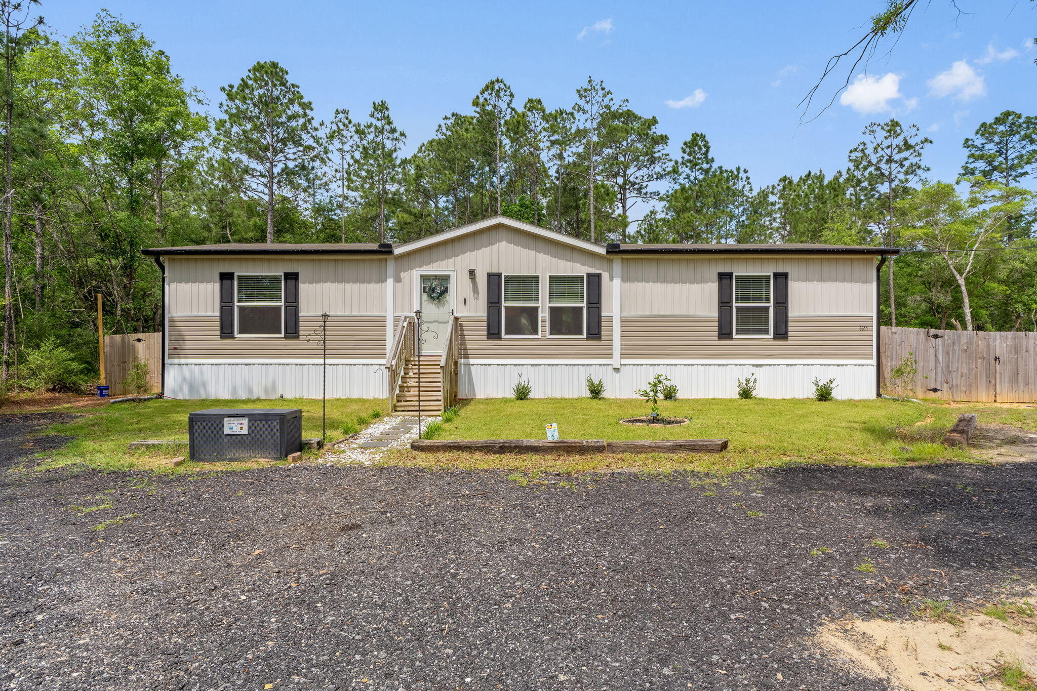 Built in 2022 and exceptionally maintained, this 3-bedroom, 2-bath home sits on a full acre in a peaceful setting surrounded by nature. A spacious horseshoe gravel driveway offers plenty of room for parking and easy pull-through access. Inside, the open-concept layout features a split-bedroom design, recessed lighting, a few Smart WiFi switches, a WiFi-enabled fan, cordless vinyl blinds, and an Ecobee Smart Thermostat. All bedrooms include walk-in closets. The kitchen is outfitted with a custom coffee bar and nearly new LG French-door fridge & whisper-quiet 3-rack dishwasher. Step out to a 10x16 screened-in back deck with accessible under-deck storage, a cozy Fire-Pit area, 10x12 Shed and a Privacy Fenced yard with Zoysia grass. Other great outdoor upgrades include Govee Permanent Smart Light on the exterior of the home. The outdoor accent lighting, full glass storm door and fiber internet add comfort and convenience to this serene property. Enjoy the summer days in the well maintained 16-ft above-ground pool as it conveys with the home or it can be removed at the buyer's request.