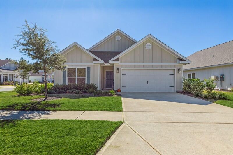 Check out the photos! Some rooms have been updated with additional photos now that the home is vacant!Motivated Sellers!! You don't want to miss out on this gorgeous 4 bed/2 bath home built in 2021. It is located on a beautiful corner lot in the gated Firefly neighborhood within Hammock Bay! These motivated sellers are offering $2,000 at closing with an acceptable offer!With over 2,000 square feet of living space, the Delray model offers its owners the privacy of a split floorplan. In the heart of the home, you will find plenty of room for entertaining with the open concept kitchen, living room, dining area, and newly added screened-in back porch. The kitchen comes complete with a large island, beautiful granite countertops, a separate corner pantry, and stainless-steel appliances.