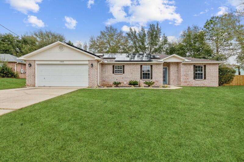 Newly updated home in South Crestview with short commute to local bases, schools, shopping, and I10! With fresh paint throughout, granite countertops and subway tile backsplash in the kitchen; low maintenance landscaping, and wonderful natural light, this is the home for you! The spacious living room opens to an office/flex space overlooking the front yard and the back yard has plenty of room for your pets to roam. The Master bed/bath are split from the additional bedrooms for added privacy and Master bath has been updated with tile floors, updated cabinets/vanity, and countertops! Other features include: Laminate flooring, Nest Thermostat, Ring Doorbell and window alarms, Shed, privacy fence, Roof replaced 2018, and Solar Panels added August 2020 with monthly payment of $168.96.