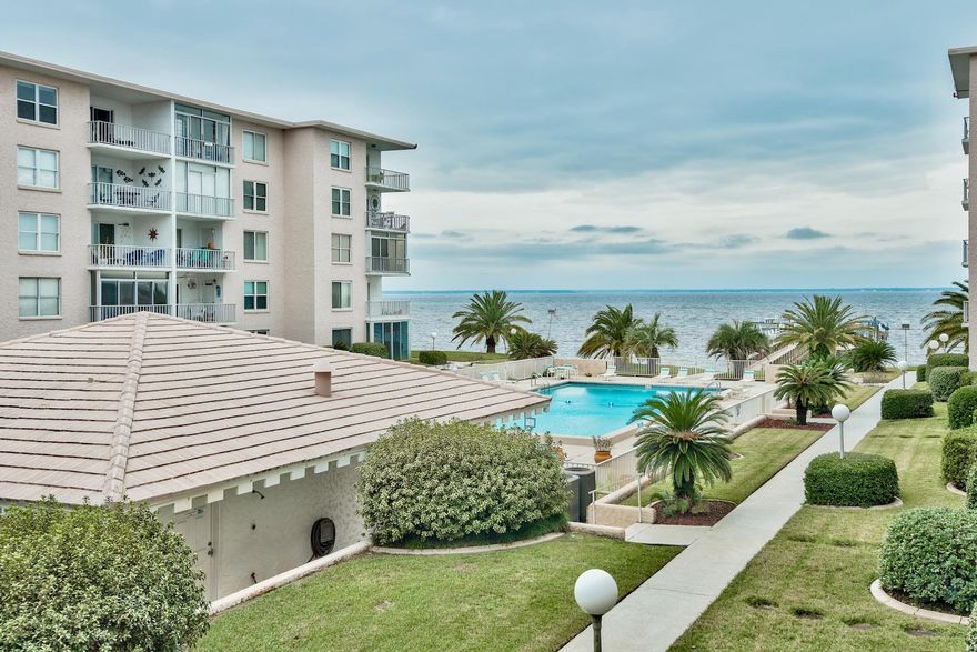 For those seeking low maintenance, value-driven, waterfront condo living in a well-established, friendly place, this Century Park condo on Choctawatchee Bay could be your next vacation home or investment. The 2-bedroom, 2-bath second floor condo evokes an exceptional warmth with new hardwood floors in bedrooms and living room. The linear open concept of the kitchen, breakfast counter and dining space seamlessly flowing into the living room contributes to efficiency and comfort. Sliding doors open to a charming enclosed balcony for year-round enjoyment. The 5-story, U-shaped complex is very inviting with a center heated swimming pool and palm trees, picnic tables, lovely landscaping and a delightful dock extending into the bay. With 28 boat slips and close proximity to Joe's Bayou, it's easy for the boating and fishing enthusiast to enjoy the 129 surface miles of this diversified natural bay. It is home to a wide variety of fish, dolphins and exotic birds. Condo rentals have a 6-month minimum requirement, and the association fees are reasonable. Long-term residents or tenants create the kind of calm, friendly environment people travel the world to find. And you can own a very nice part of it here in Century Park.