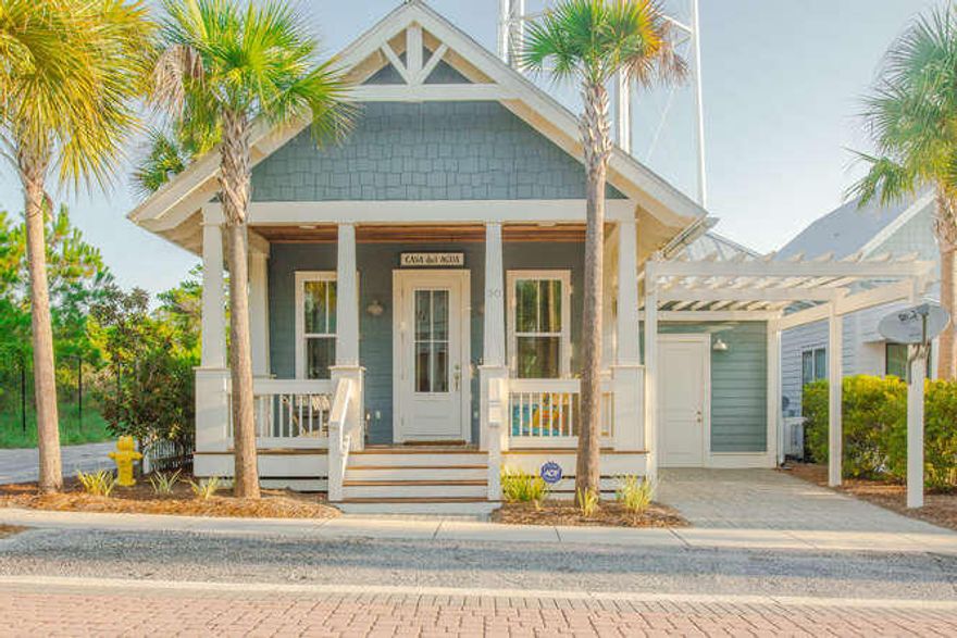 Welcome to ''Casa del Agua'', incredible price for newer construction three bedroom home in desirable Seacrest Beach. This adorable beach cottage is full of ''Old Florida'' rustic charm. The home is one story, a rare find, at the end of a quiet street adjacent to the nature trail. Not previously rented, but sold furnished and rental ready. Distressed hardwood floors with a vaulted wood ceiling. The kitchen features carrera marble counters, custom cabinets, unique lighting, and stainless appliances including a five burner gas range and double oven. The Master bath has two sinks, beautiful marble tiles, and a huge shower with dual shower heads. The other Jack and Jill bath has two large vanities, marble flooring and an enclosed tub. Enjoy the outdoors on the front porch or in the