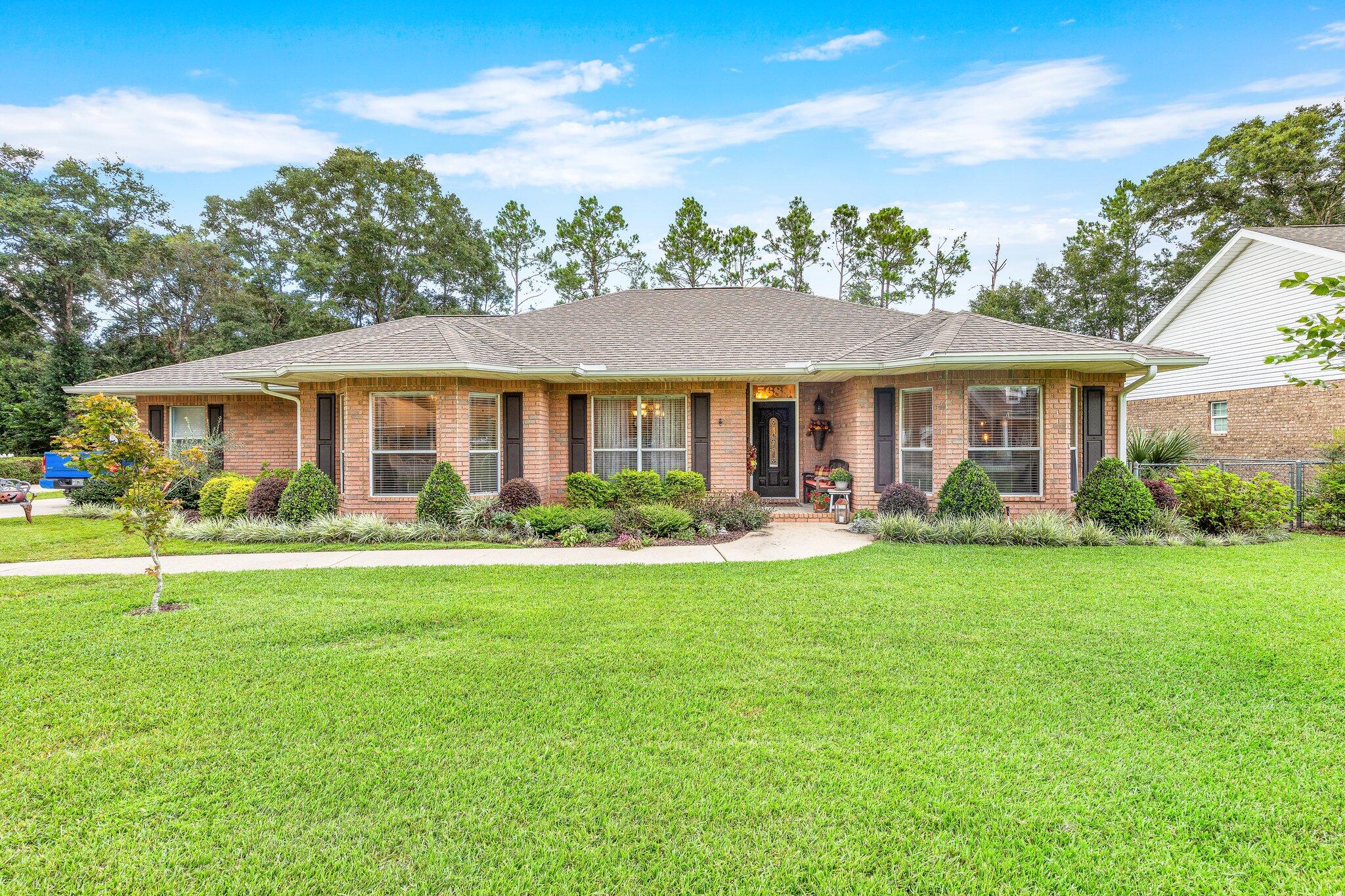 You won't find another custom home like this at this price point! Welcome home to this beautiful CUSTOM built property with loads of great features that will definitely check the boxes of most buyers.This updated home is located in the very desirable Tanglewood Estates (across from 18th hole) and features high ceilings with no popcorn, granite countertops, a large master suite, custom walk-in tile shower in master, lots of built-in shelving and storage throughout home, a wood burning fireplace, two bay windows allowing plenty of natural light, oversized washroom with basin, an oversized CLIMATE CONTROLLED 2-car garage, an additional workshop, full irrigation and well system, and so much more! Age of appliances: Roof- 2 yrs. WH- 4-5 yrs