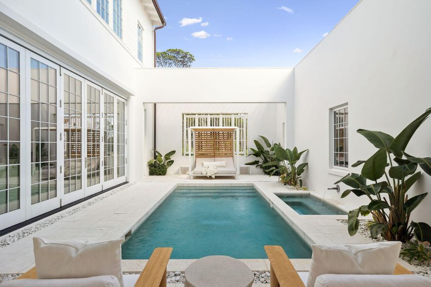 Experience refined coastal living at 53 Portico Lane, a SummerStory Showcase Home in the coveted Kaiya Beach Resort. Architecture by Khoury & Vogt Architects (KVA), thoughtfully featured in collaboration with the nationally acclaimed boutique, SummerStory, this 4,414 sq ft retreat offers 4 bedrooms + bunk and game areas, 5.5 baths, and an inviting bedroom suite on the main level. The home's private courtyard reveals a serene pool, spa, and fully equipped summer kitchen, while interiors feature Wolf and Sub-Zero appliances, Waterworks fixtures, and curated finishes.  Framed by preserve views, every element speaks to timeless elegance and elevated coastal design. Spaces designed for living with generous closets, a flex space on floor two and dual sinks in the ensuite bathrooms. Close proximity to the beach with deeded beach access and usage. Kaiya Beach Membership is available as well as the nearby Watersound Camp Creek Golf and Beach Club.  53 Portico offers an urban lifestyle while still maintaining a respite from the hustle and bustle. 