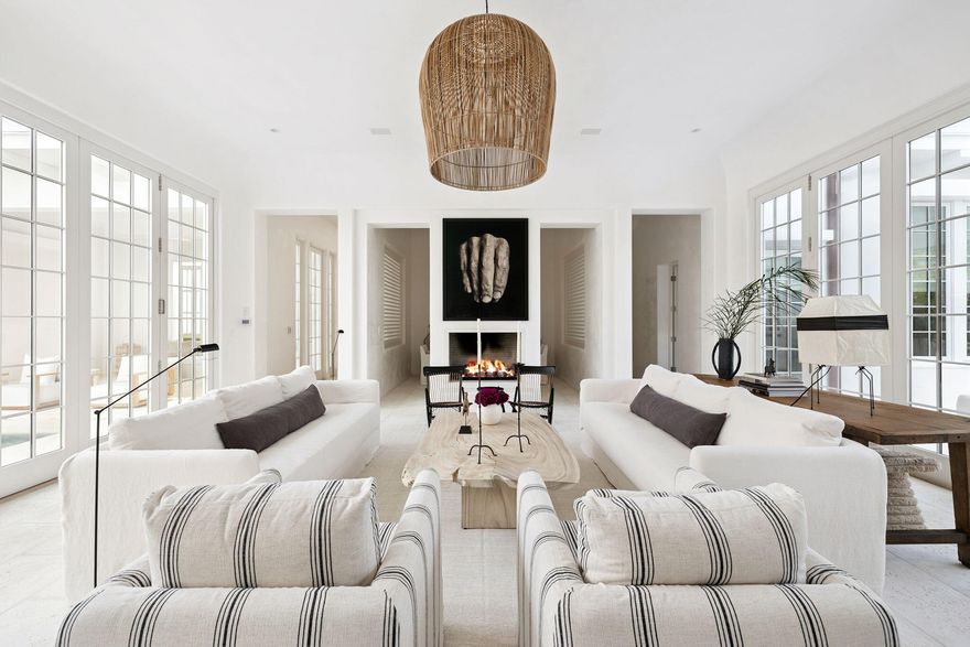 Experience refined coastal living at 53 Portico Lane, a SummerStory Showcase Home in the coveted Kaiya Beach Resort. Thoughtfully furnished in collaboration with the nationally acclaimed boutique, SummerStory, this 4,414 sq ft retreat offers 4 bedrooms + bunk and game areas, 5.5 baths, and an inviting bedroom suite on the main level. The home's private courtyard reveals a serene pool, spa, and fully equipped summer kitchen, while interiors feature Wolf and Sub-Zero appliances, Waterworks fixtures, and curated furnishings. Framed by preserve views, every element speaks to timeless elegance and elevated coastal design.