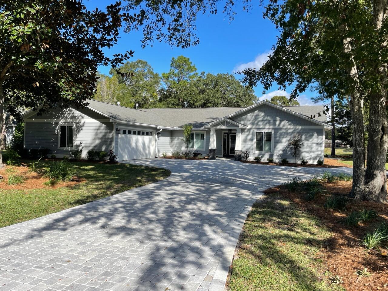 Beautifully remodeled 3-bedroom, 2.5 bath Golf course home situated on the 9th Fairway in Bluewater Bay! Enjoy spectacular views of the fairway & lake while entertaining on your back patio. Gourmet kitchen features granite countertops, center island w/breakfast bar, stainless steel appliances, gas stove, & range hood. Wet bar & gas fireplace in Family room. Living room w/custom built-in shelves, formal living room, & dining room. Master suite has sitting area/office w/built-in desk, Large walk-in closet w/built-ins, master bath w/double vanities, custom cabinetry, jacuzzi tub, & separate shower. Two additional bedrooms plus full bathroom on opposite side of home w/bonus playroom. Spacious laundry room w/custom countertop, cabinets, & separate sink. Too many features to list!