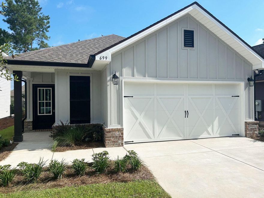 Awesome builder rate plus FREE refrigerator. Restrictions apply.The EVERGLADES II J in Crescent Mills at Hammock Bay community offers a 4BR, 2BA, open design. Upgrades added (list attached). Features: double vanity, custom tiled shower with frameless door, and walk-in closet in master bath, kitchen island, pantry, covered rear patio, custom kitchen backsplash, crown molding, LED lighting throughout, smart connect WIFI thermostat, smoke and carbon monoxide detectors, landscaping package, architectural 30-year shingles, flood lights, and more! Energy Efficient Features: water heater, electric kitchen appliance package, vinyl low E windows, and more! Energy Star Partner.