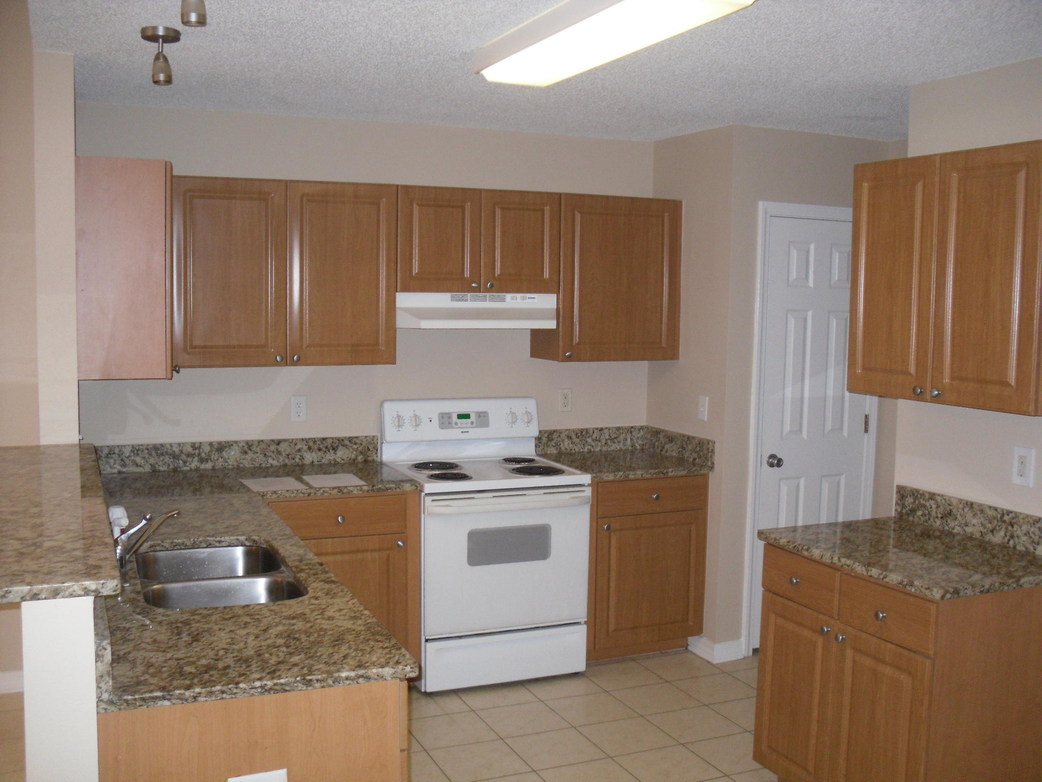 Great single story Townhouse with lots of space. Beautiful new Granite Countertops with under mount sinks, New Carpet and all fresh paint. This unit is a must see and will go fast. Property is being sold as is and any information deemed important by the buyer should be verified. Call today for your showing appointment.