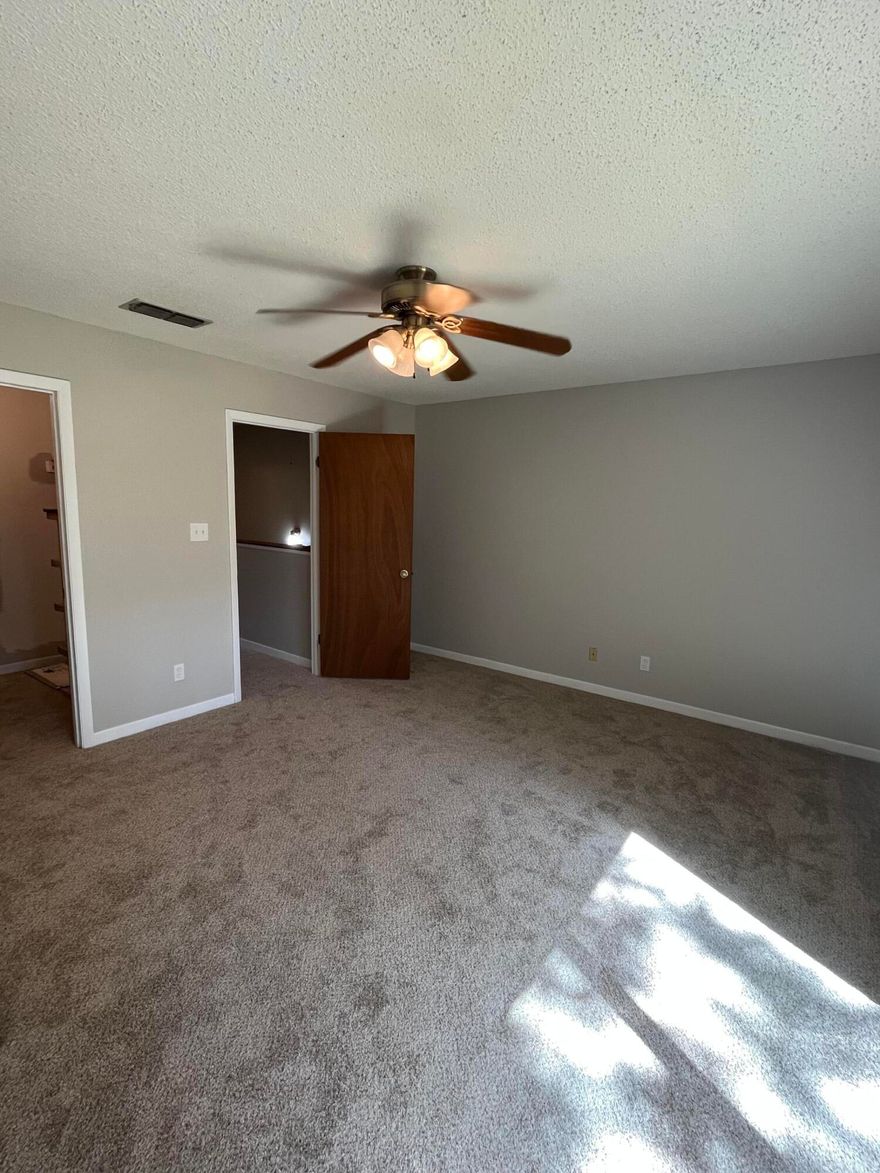 Cute townhome located off of Eglin Parkway. This unit has new carpet, LVP, sliding glass doors, paint and stainless steel appliances.  Washer & Dryer available. Security deposit is $2200.