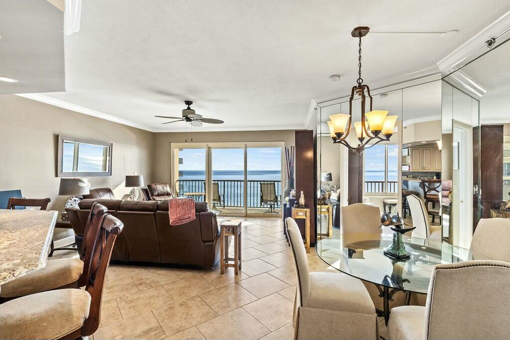 Don't miss this turn-key unit, fully furnished, including kitchen dish and cookware, perfect for a private residence or a second home and is located in the premier, gated, non-rental condominium community of Summerwinds in Panama City Beach. The unit is well appointed with tasteful furnishings, fine finishes, 9 ft ceilings, open living/dining area with panoramic views of the Gulf from the Living Area and Master Bedroom. The master bath has been completely renovated and new carpet installed in the master bedroom and guest bedroom. The unit is equipped with motorized hurricane shutters easily operated by remote control. Also included is an assigned enclosed single car garage space (E4). Amenities of Summerwinds include Community Clubhouse, two community pools, beach, and fitness area. Buyers are to verify all dimensions and homeowner