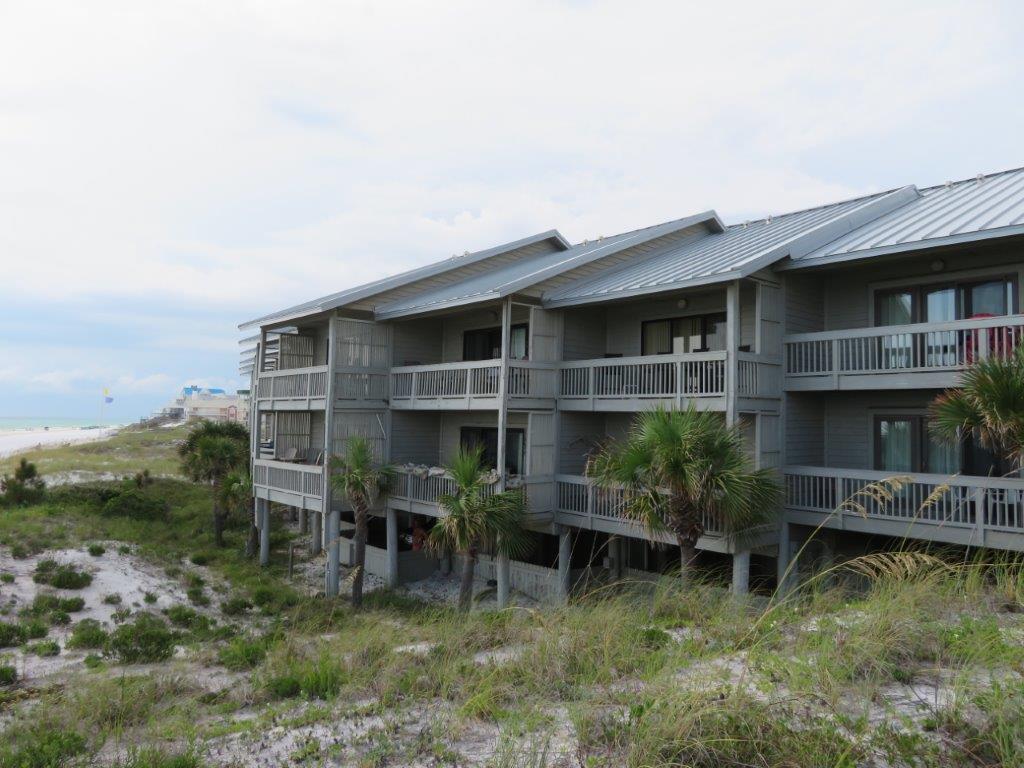 Gulf front townhome with unobstructed views from both levels! Open living areas with hardwood floors! Master suite with private balcony access and en-suite bathroom! Two decks overlook beach and gulf!