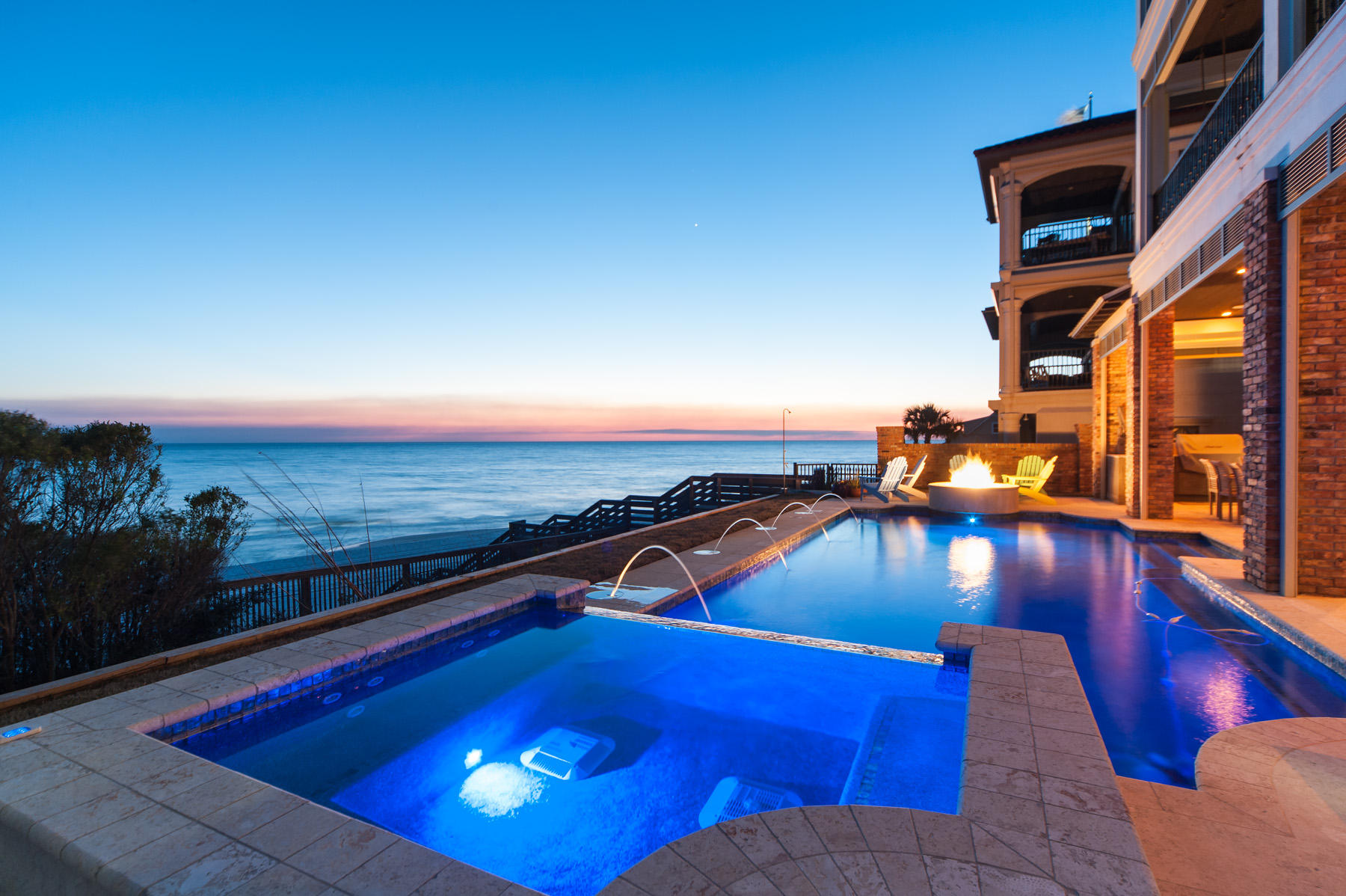 Spectacular views of the gulf are on display from all four floors of this waterfront home in Blue Mountain Beach. An all-inclusive outdoor space boasts a sought after gulf front pool with hot tub, fire pit, and summer kitchen surrounded by 500 square feet of terrace. Exploiting one of the highest elevations on the Gulf of Mexico rim are the waterfront balconies amounting to over 2,000 square feet of outdoor living space. Easily enjoy any one of them with the assistance of a residential elevator. Though situated on a high bluff, a protective sea wall adds to the peace of mind, already set firmly in place by local luxury builder Davis Dunn in its certified Fortified construction. As its interiors unfold, you will find that each space is as remarkable as the one that came before it.