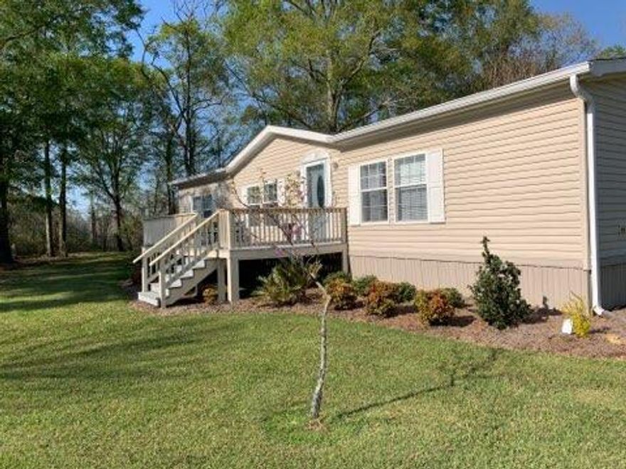 If you are looking for privacy and 10 acres, look no further!  From the moment you enter the home, you think it is brand new.  Immaculately kept home and grounds..  HVAC and roof recently replaced.  Kitchen has plenty of cabinets and has a center island. Appliances, washer and dryer stay.  Split bedroom floor plan.  Master bath has spacious garden tub, shower, and double sink vanity.  Plenty of space in master closet.  Living room has that ''welcome home'' feel, an electric fireplace, and plenty of light from large window.   Outside is landscaped with all types of shrubs and flowers. There's even a gazebo and firepit. 20x12 covered deck on back and 10x20 deck on front. 36x24 pole barn with concrete pad for parking vehicles. Fenced pasture with pond. Beaver pond also on property.