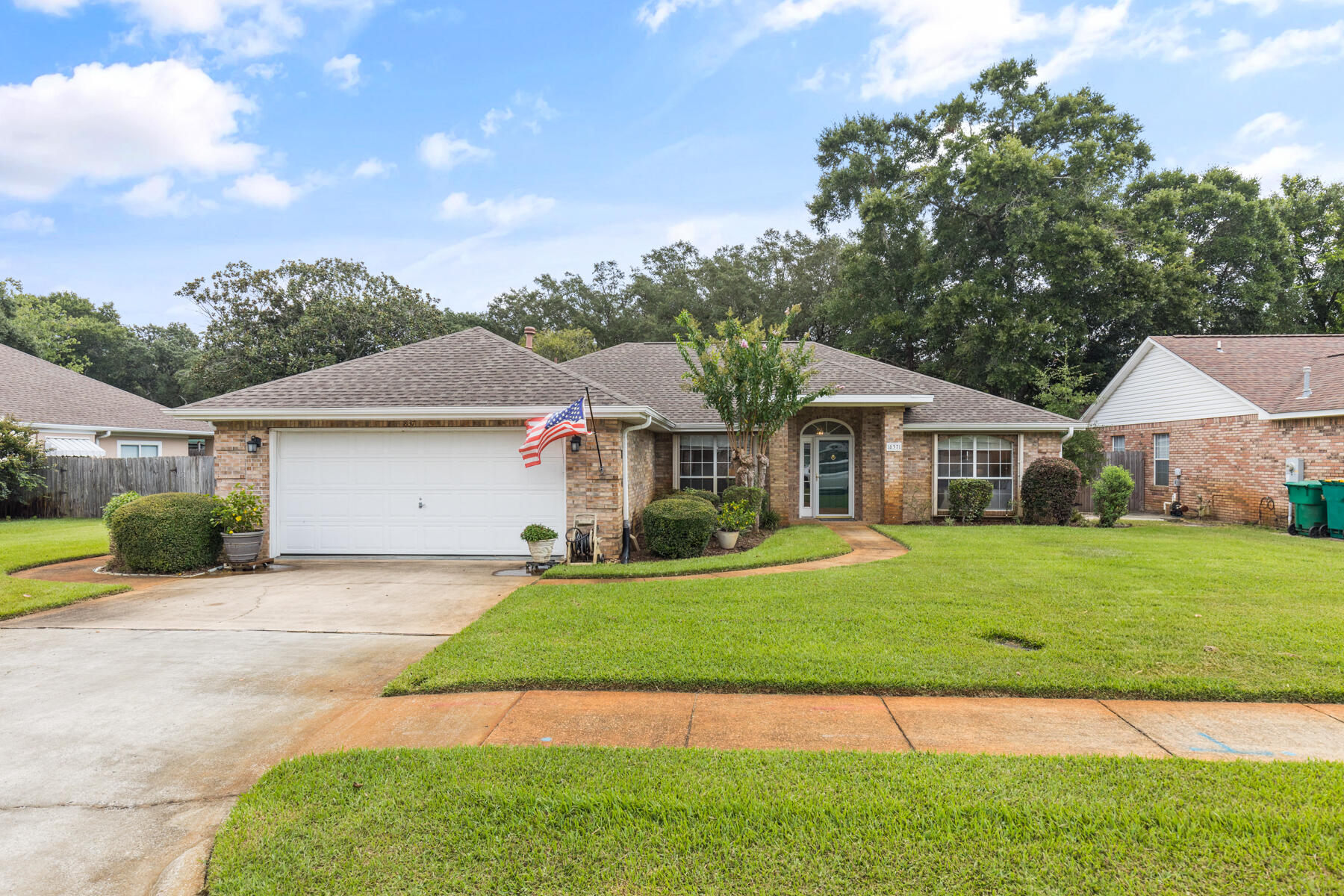 This charming three-bedroom house features a classic design with a welcoming facade. The exterior is brick complemented by a a nice architectural singled roof. A well-maintained lawn and a front walkway lead to the front door, flanked by neatly trimmed shrubs and flower beds. Upon entering, you're greeted by a formal dining room and onto a spacious living room with ample natural light streaming in through large windows. The living room is cozy and adorned by the kitchen and breakfast room. Comfortable seating arrangements and tasteful decor make it a perfect spot for relaxation and entertaining guests. The kitchen is an open and adjacent to the living area. It features a breakfast bar, and plenty of counter and cabinet space. The master suite is a private retreat with a generous layout, a walk-in closet, and an en-suite bathroom. The room is designed for comfort, with ample space for a king-sized bed and additional furnishings. The other two bedrooms are versatile and can be used as children's rooms, guest rooms, or home offices and share a second bathroom. This three-bedroom house balances functionality and comfort, making it a versatile choice for families or individuals who need extra space. Its design incorporates modern amenities while maintaining a warm and inviting atmosphere. The back yard is fully fenced and has two gates, one to the front and one to the rear. this extra gate allows you to park your boat, camper or whatever the need by gaining access to the rear from the street behind. Just one more check mark this home has. Call us today about seeing this beauty.