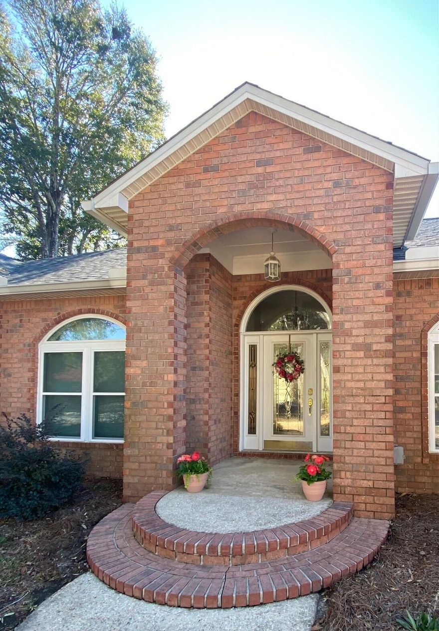 Welcome to this stunning 4 BR brick home on the golf course inside a gated community.   The renovated kitchen is a showstopper with quartz countertops, new cabinetry, a five-burner gas cooktop, double oven, generous workspace and walk-in pantry.  All 3 bathrooms have been renovated with modern updates as well.  Each bedroom has new carpet.  Additional highlights include a gas fireplace, dedicated home office, a bright and inviting sun porch (heated and cooled) overlooking the golf course, a new black aluminum fence, new front of house windows, and a new HVAC unit with a blue light for added quality and efficiency. This move in ready home combines luxury upgrades with an unbeatable golf course setting for the lifestyle you've been waiting for.