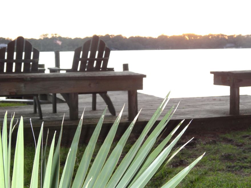 Located within walking distance to Bluewater Bay Marina and LJ Schooners is this end unit with one car garage and great living spaces. The living room at entry level features a fireplace and opens to a 14'x6' rear deck. The full kitchen and great room/dining combo has a rear screened balcony for bringing the outdoors inside. A study/loft is located on the 2nd bedroom level with a roomy bedroom and full bath. The sunny loft overlooks the living room and has views of the natural area to the rear.The large master suite is located on the upper level for utmost privacy. A one-car garage has a 12'x8' storage room at the end which could be opened to house 2 cars. Bluewater Bay's other amenities are just out your door. A community bayfront deck with seating, grill and dock is yours to enjoy!