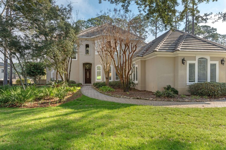 This distinguished custom-built residence is situated within the secure Burnt Pine Community on a private lot accented by mature oaks and meticulous landscaping, providing notable views of the natural preserve in a peaceful environment. The main level includes an elegant entry foyer, a gourmet kitchen with modern appliances, a formal dining area, a generous living room, a refined family room, a guest half bath, and a master suite featuring a full bathroom and direct access to a secluded outdoor jacuzzi. On the upper floor, three spacious bedrooms--one offering a private balcony--and a dedicated family or sitting area ensure ample accommodation. Thoughtful design elements include abundant storage, an oversized two-car garage, and a separate garage for golf carts. Entertainment spaces feature