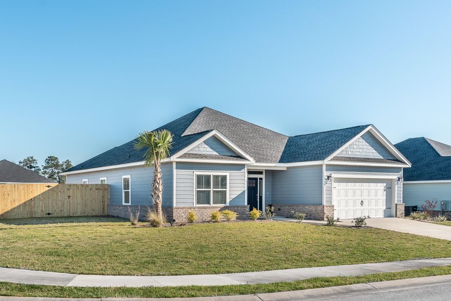 This beautiful move in ready home has a spacious open floor plan featuring 3 bedrooms, 2 baths and a 2 car garage. It is situated on a large corner lot. The kitchen opens up to the dining & living area making this home great for entertaining family and friends. The living room & Master Bedroom feature tray ceilings with crown molding. The large master bedroom is separate from the guest bedrooms which gives added privacy. The master bathroom includes double vanity with granite counter tops, two walk-in closets, a deep soaking tub and separate walk-in tiled shower. The kitchen showcases immaculate upgraded bisque painted cabinets, upgraded farmers sink, and granite counter tops with a hop up bar for additional seating. This home features hard surface flooring through out.