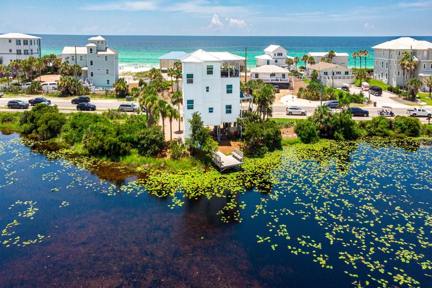 3-Bed, 4-Bath Beach Home on Rare Coastal Dune Lake with Dock and Gulf Views on 30A -  Expansive Gulf and Coastal Dune Lake views define this three-story 3BR/4BA beach home with 2,071 sq ft of living space and 330 feet of rare coastal dune lake frontage along 30A. Panoramic water views from nearly every room and balcony create a serene coastal backdrop, ideal for full-time living, a second home, or a high-performing vacation rental.Recent updates within the past year include a new metal roof, windows, Hardie-board exterior, fresh paint, and quartz countertops, providing modern comfort and peace of mind. The top-floor primary suite features a private balcony that overlooks the rare coastal dune lake with views of the Gulf. A private dock allows for kayaking, paddleboarding, and  fishing, with easy lake access and an outdoor shower for rinsing off after a day on the water. Inside, you'll find hardwood and tile floors, crown molding, a wet bar, a breakfast bar, and spacious balconies perfect for enjoying breezes and sunsets.

Located across from public beach access and steps from Stinky's Fish Camp, this Dune Allen Beach property offers proximity to Gulf Place, Topsail Hill Preserve, and all the dining, shopping, and recreation Santa Rosa Beach has to offer. No HOA and ample parking on a 0.30-acre lot add flexibility for owners and investors.

This rare property offers both beach and lake access along 30A, blending natural beauty with modern updates in one of South Walton's most desirable locations.