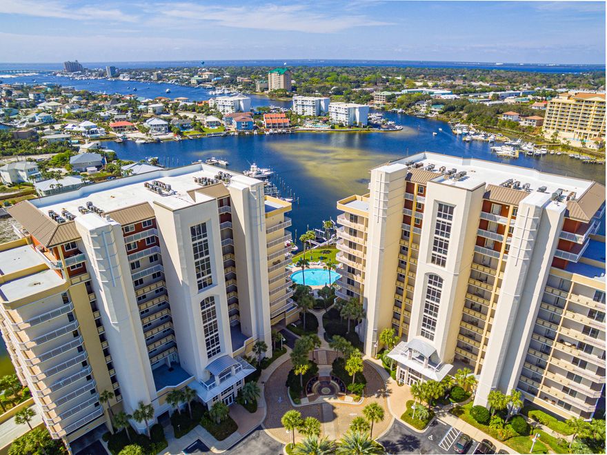 This Harbor front Condo will simply take your breath away. Harbor Landing is in a much sought after area in Destin with DEEDED BEACH ACCESS. Get picked up in a water taxi to take you to your favorite restaurant or virtually anywhere you want to go by boat. The interior of this gorgeous condo is filled with high end custom features.Open and spacious floor plan with high end plantation shutters, 10' ceilings and 9' solid core panel doors throughout. Crown moulding with trey ceilings to include double trey ceiling in the kitchen. The kitchen has custom cabinetry in a beautiful distressed wood, granite countertops with custom back splash. High end custom drapes, window treatments, and light fixtures all convey.