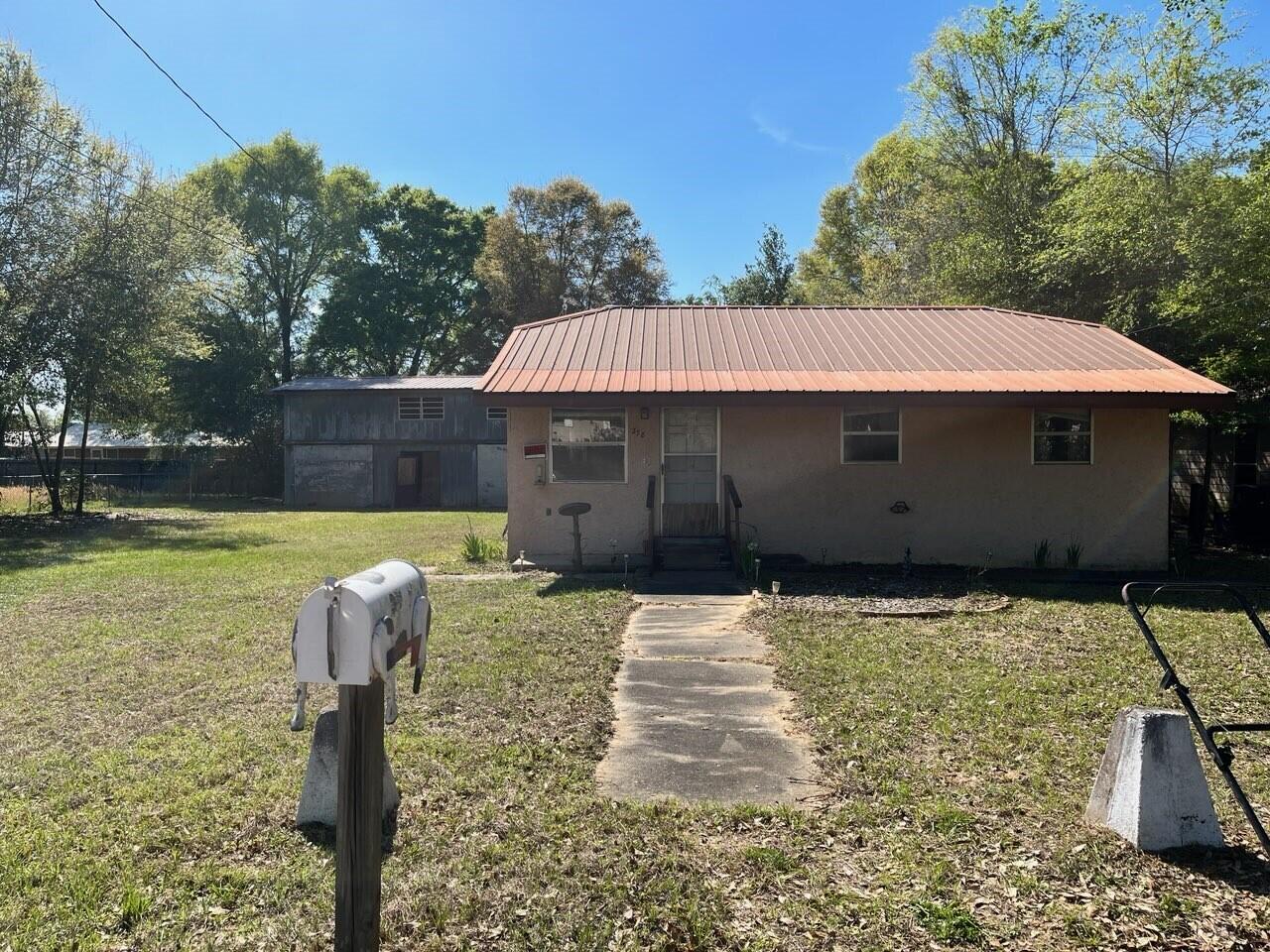 Investor Special, don't miss out on this 2-bedroom 1 bath home with a lot of potential. The outdoor workshop is the gem of this property. It is 2 stories with a cellar and electric already ran. Flat lot is larger than most in the area.