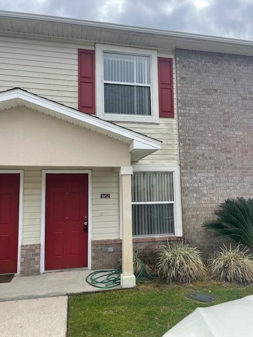 Convenient town home in Blue Water Bay with easy access to the base. Interior unit features covered entry in this 1150 sq. ft. floor plan. Laminate flooring in the living room with the kitchen, 1/2 bath, and laundry room on the 1st floor. 2nd floor features 2 bedrooms and a full bathroom. The master suite boasts dual closets. Open back patio for outdoor grilling. Unit is directly across from the complex community pool. Minutes from the EOD school and Eglin AFB. No inside smoking or vaping. Pets are not allowed.